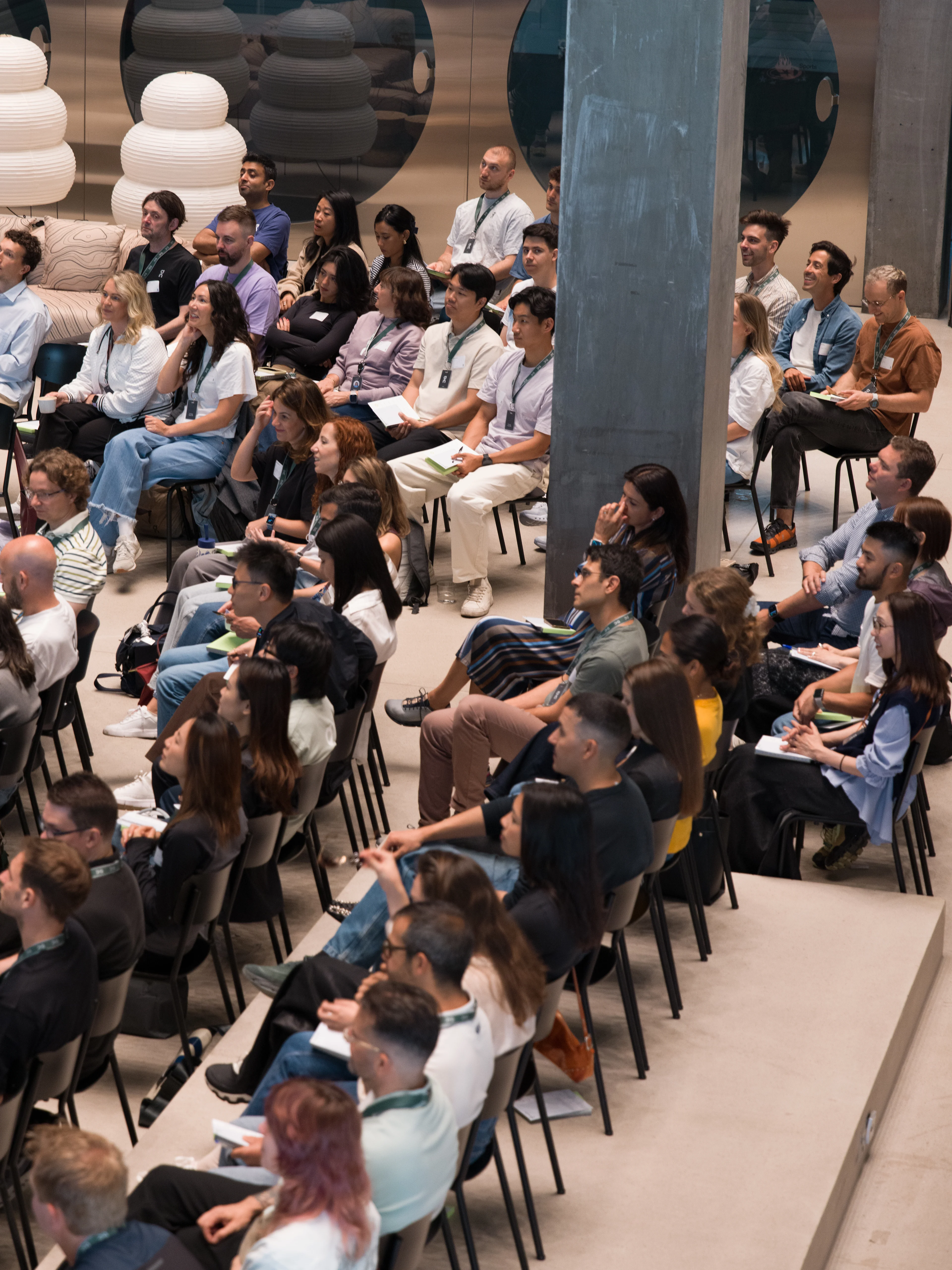 A group of people in an audience listening