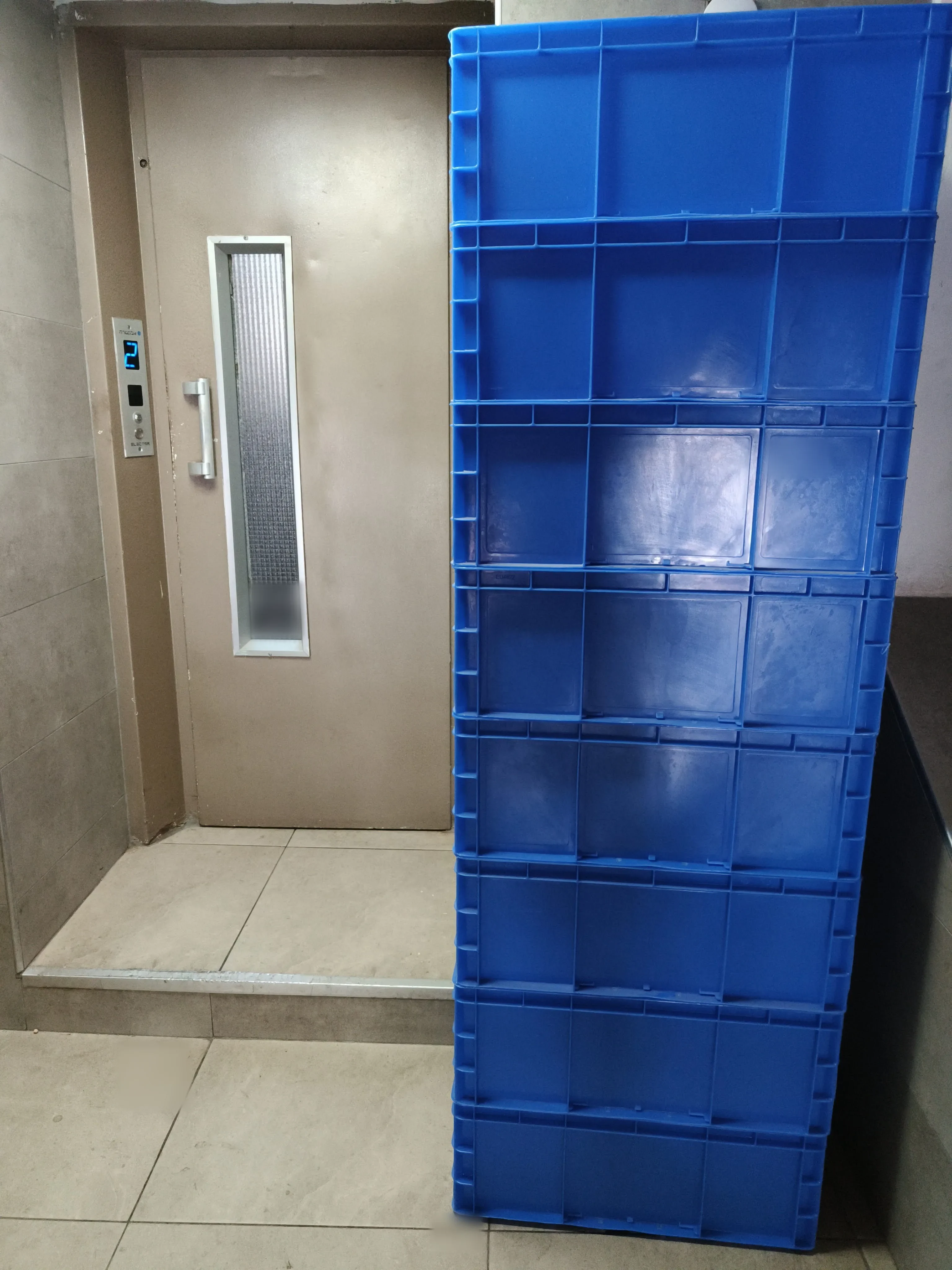 A tall column of Euroboxes in a service lift