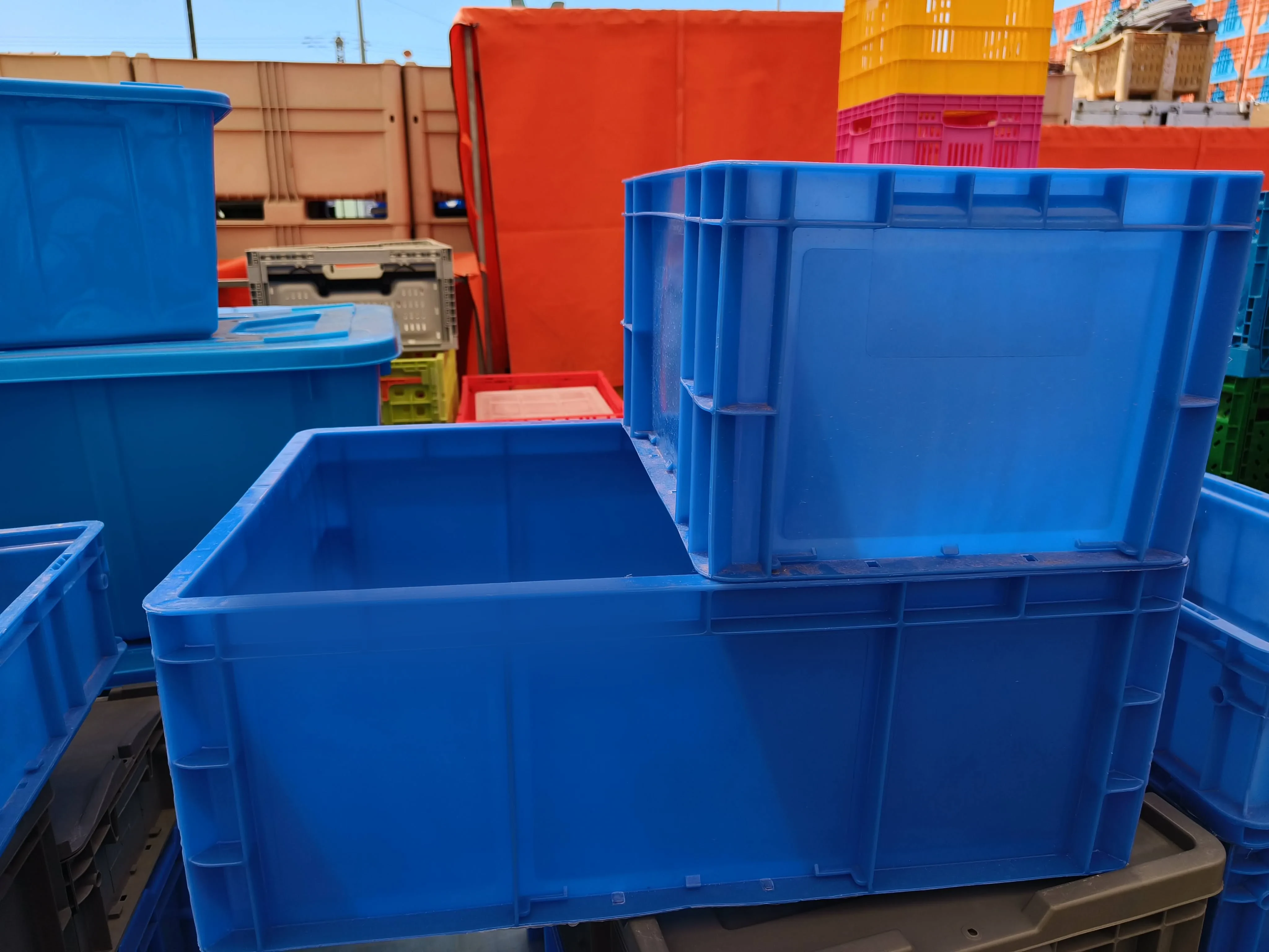 A supplier yard stacked pallet-high with Euro crates