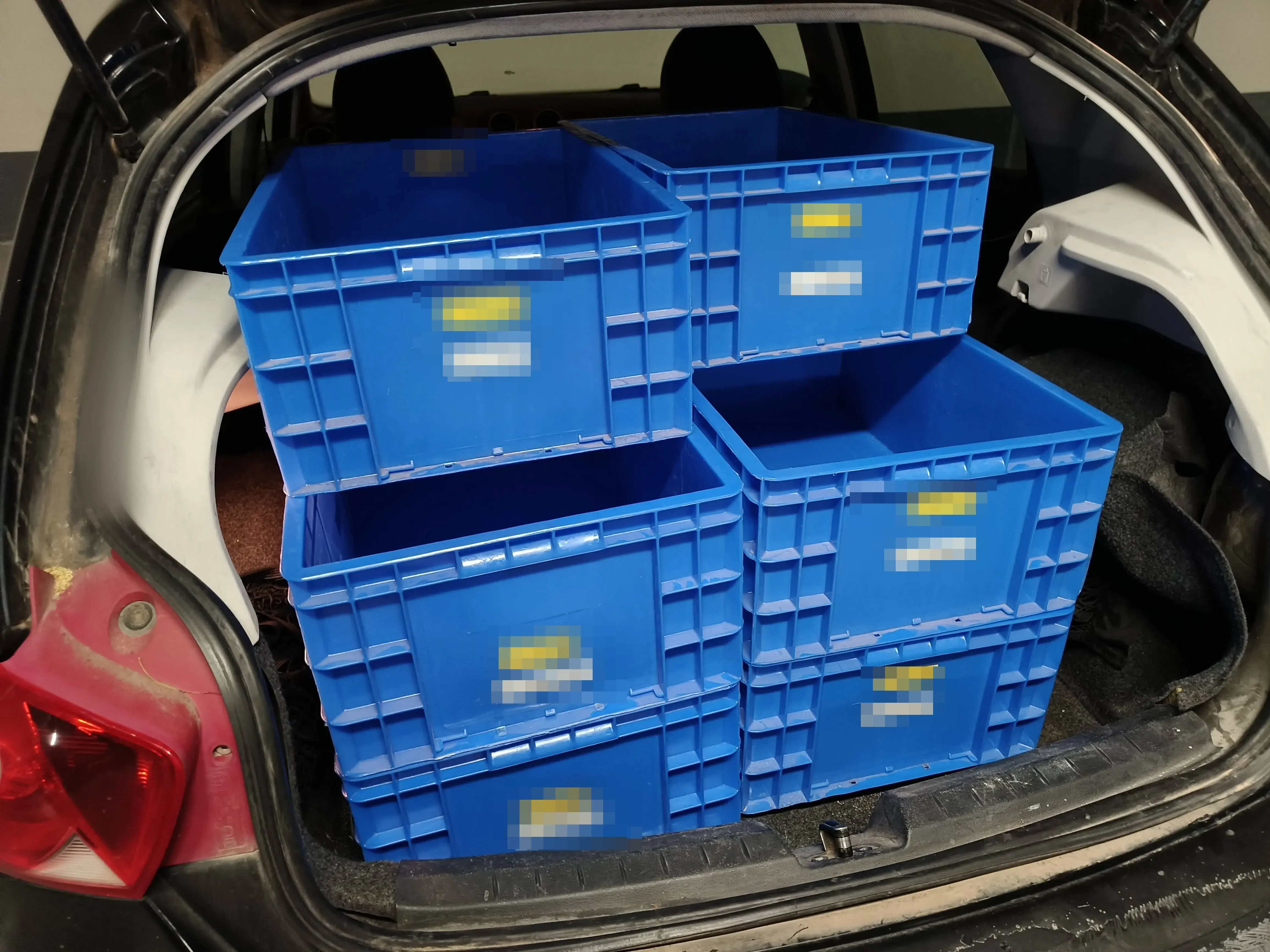 Euroboxes loaded into a car boot