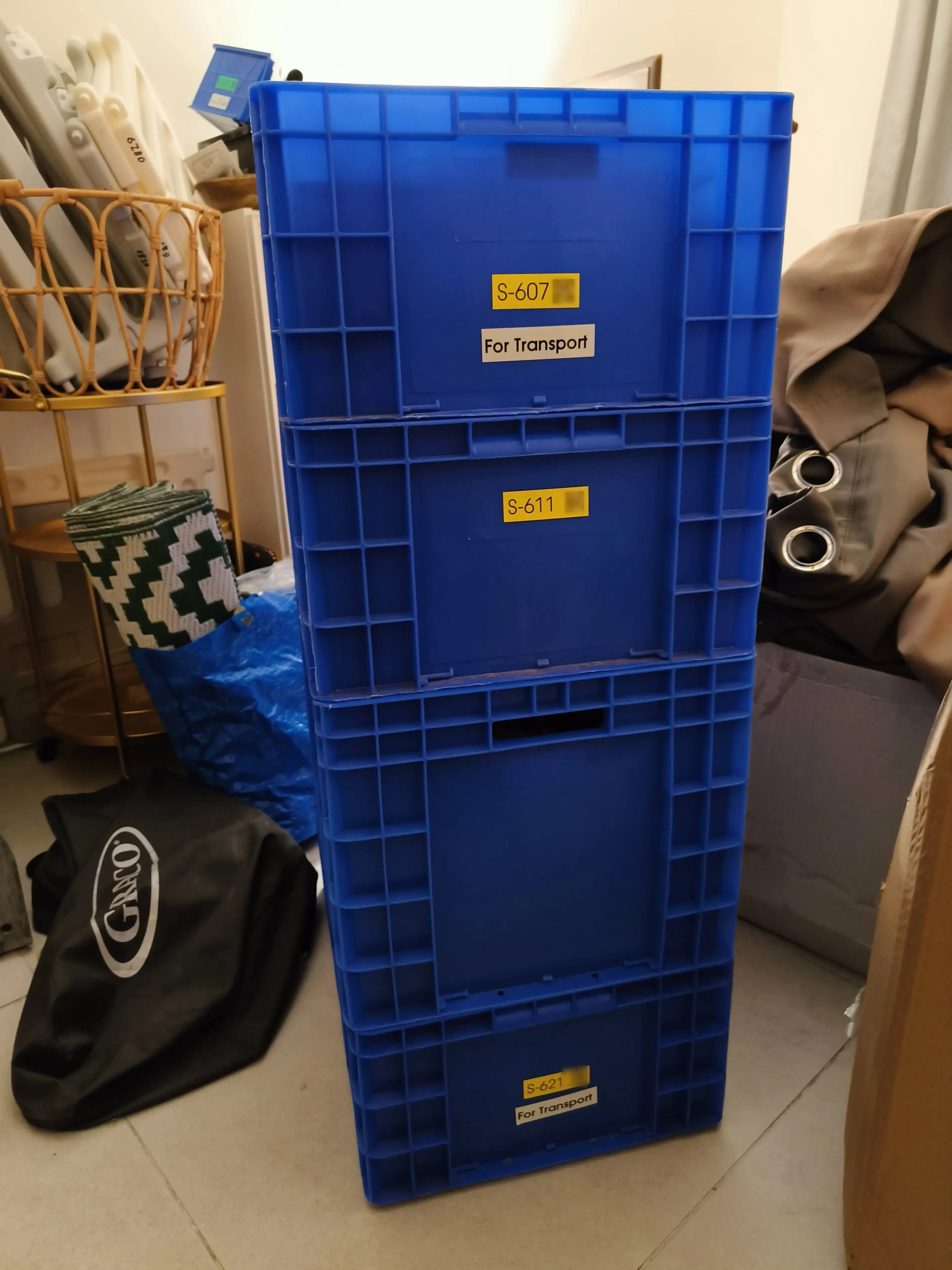 A column of interlocked boxes strapped and staged to move