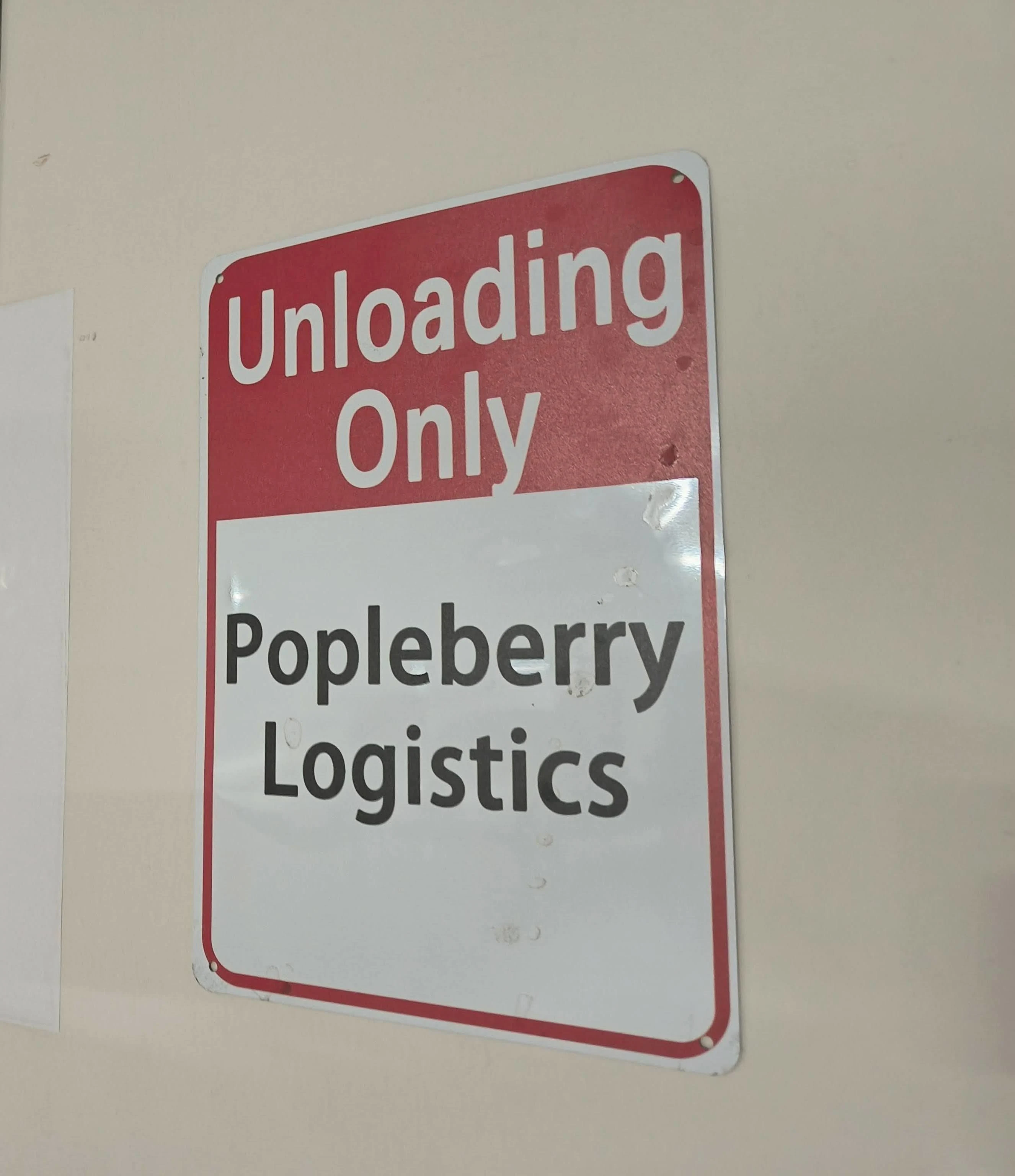 The joke that stopped being a joke: house rules, in warehouse signage.