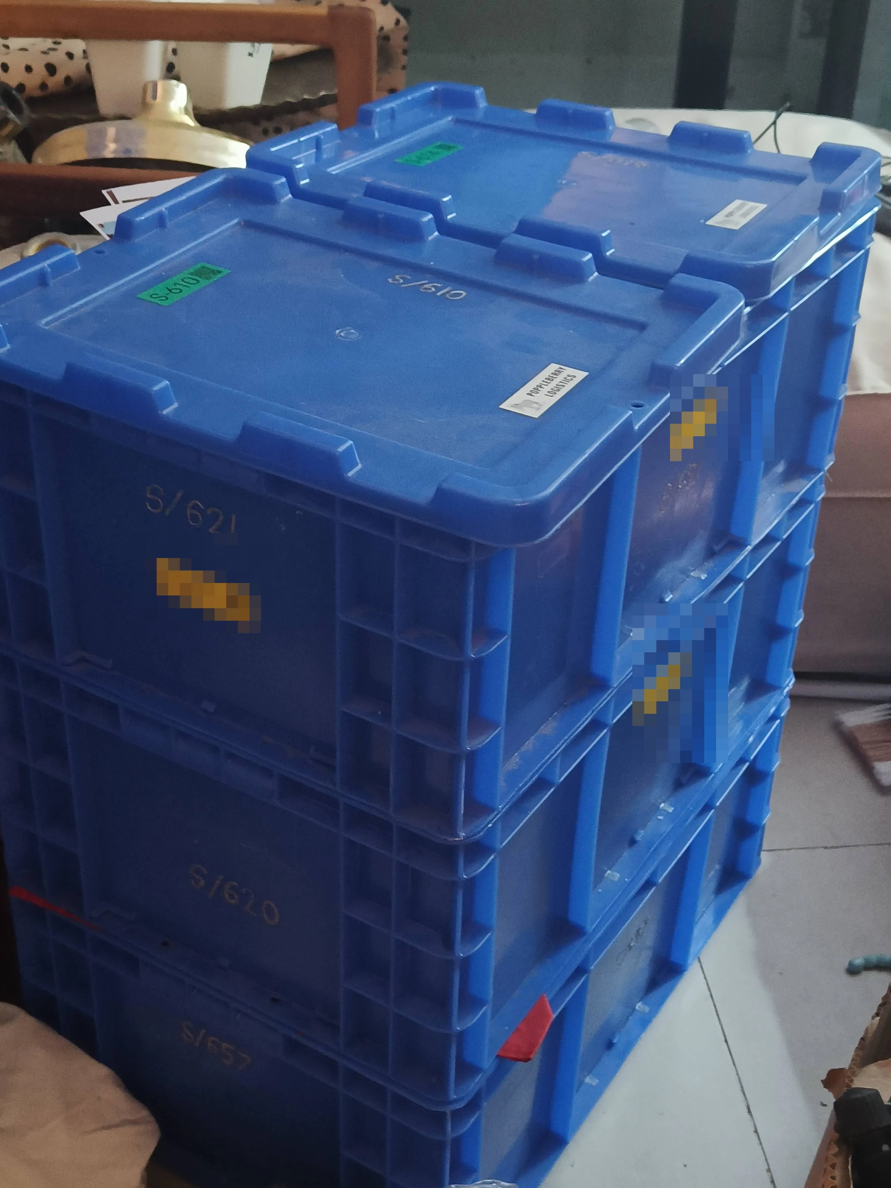 Lidded boxes in the storage stack, each with its inventory label.