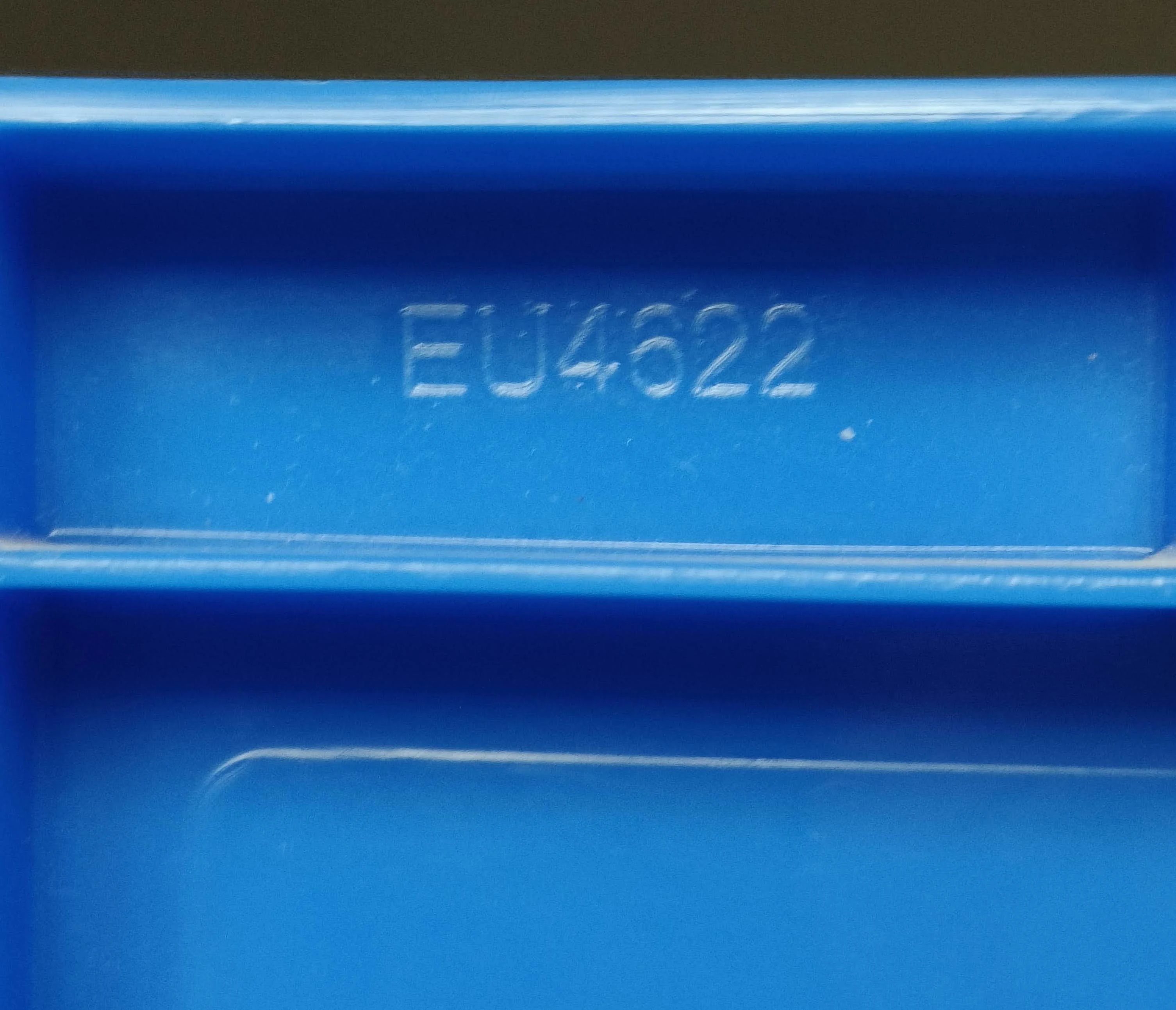 The Eurobox part number moulded into the inside wall of the box — the thing that makes the whole system searchable.