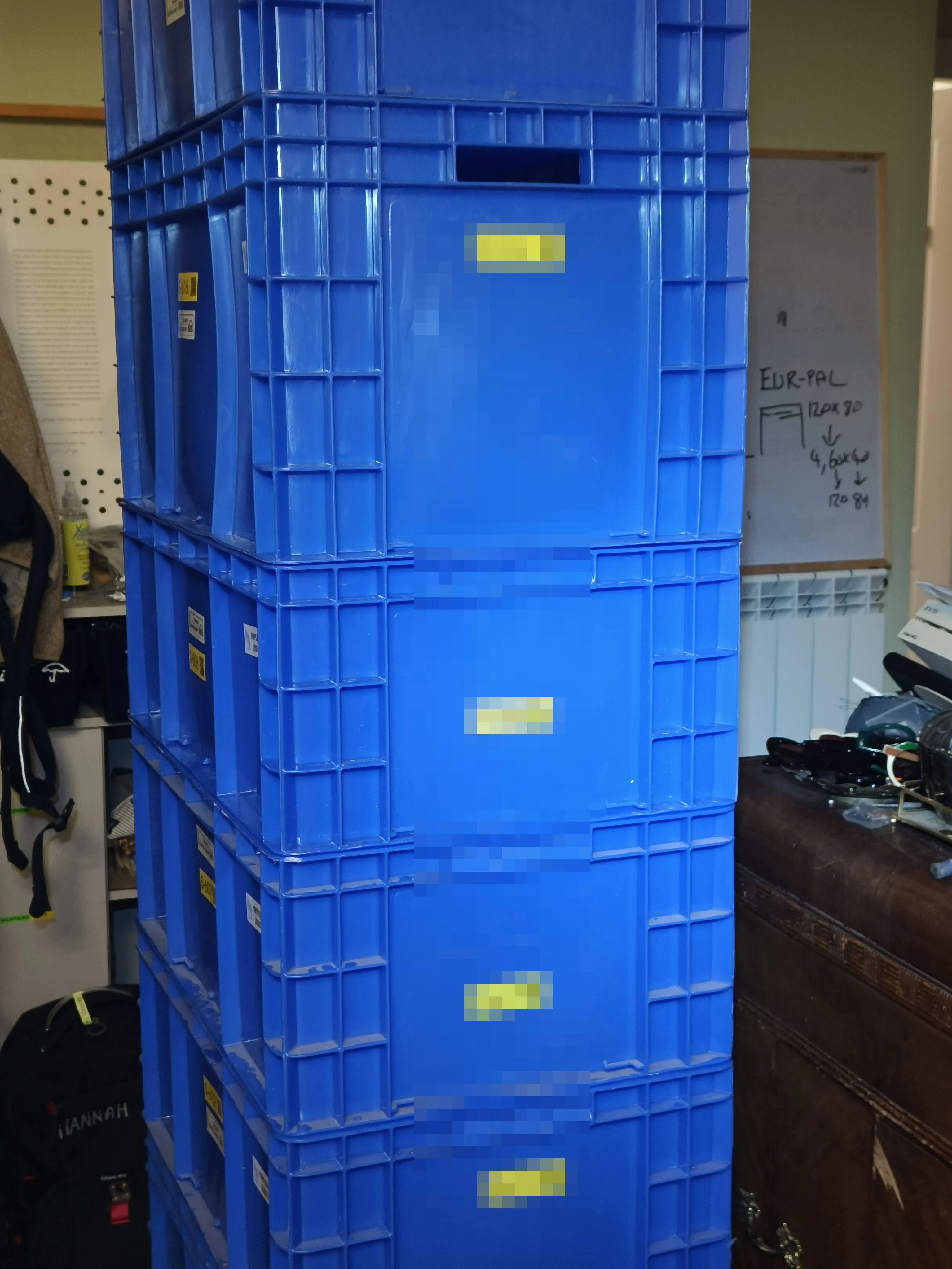 A column of labelled boxes at home — same footprint all the way up, so it stacks straight.