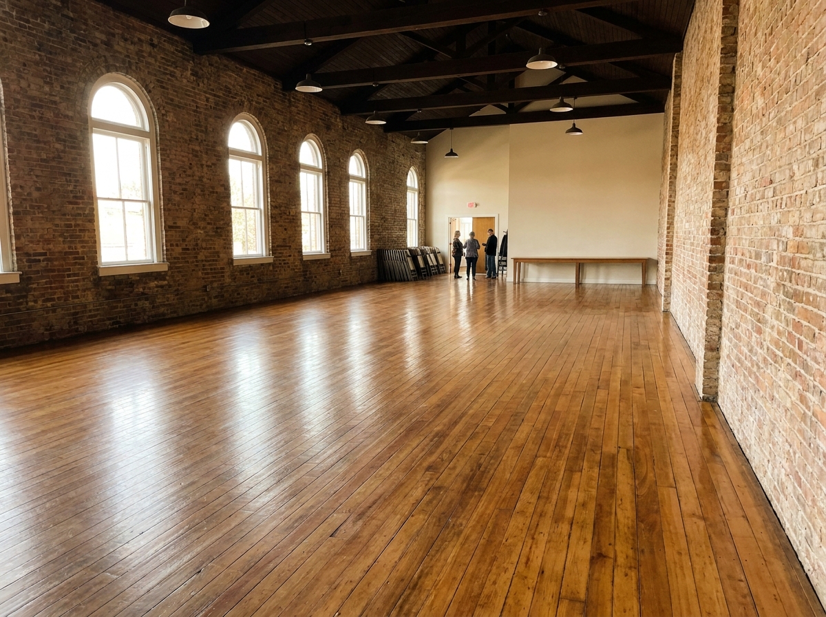 An empty, versatile event space in Cedar Rapids ready for online ticketing setup.