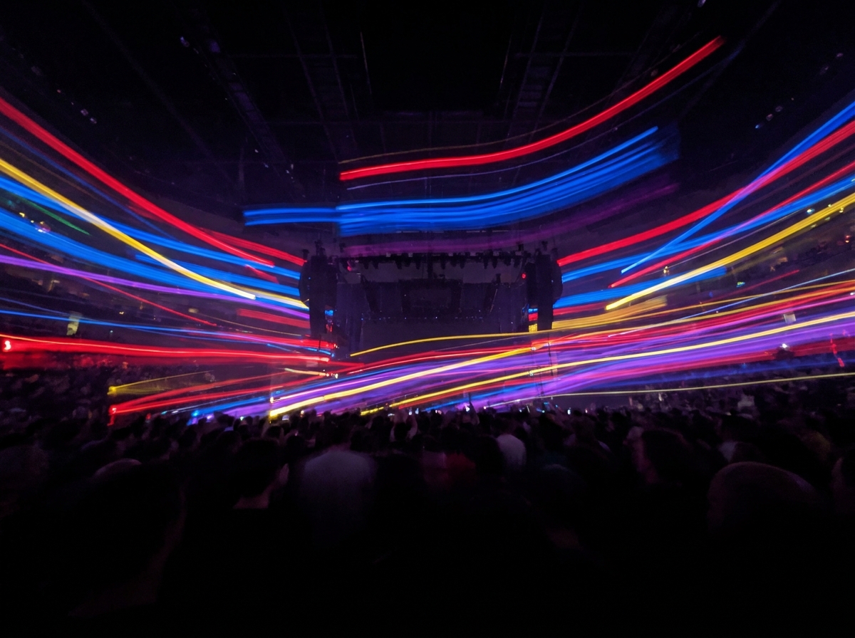 Colorful stage lights representing the energy of a live comedy event.