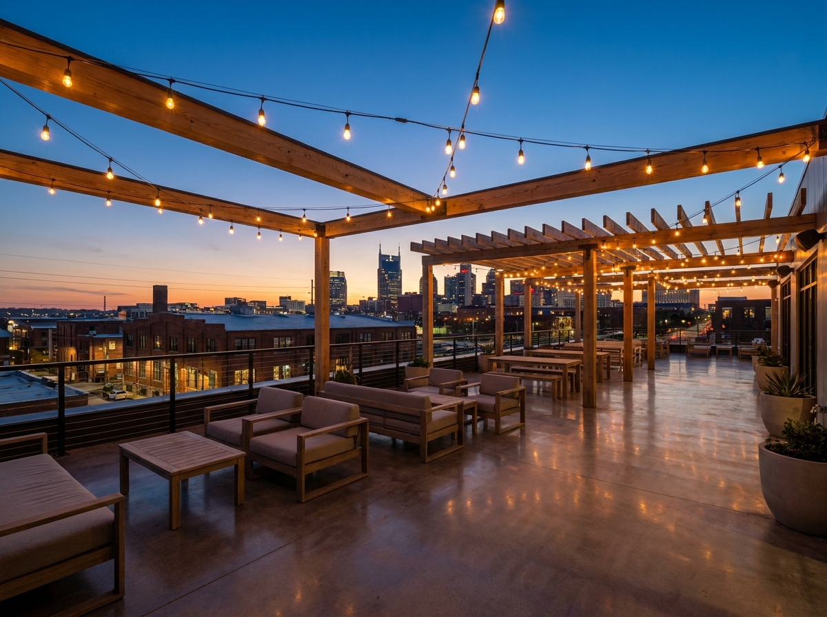 An empty rooftop event space in Nashville overlooking the city skyline at dusk.