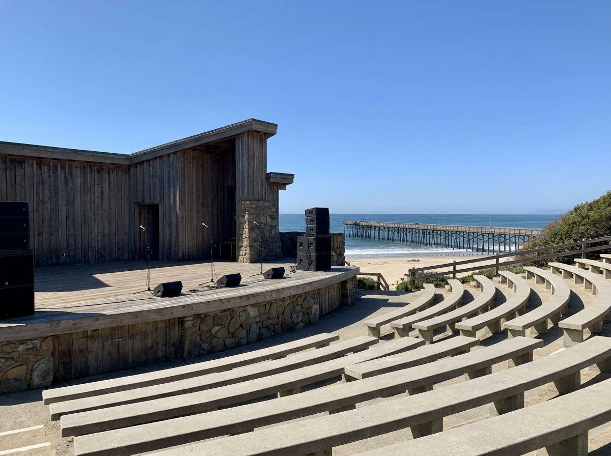 An empty outdoor stage set for a concert near the Oceanside pier.