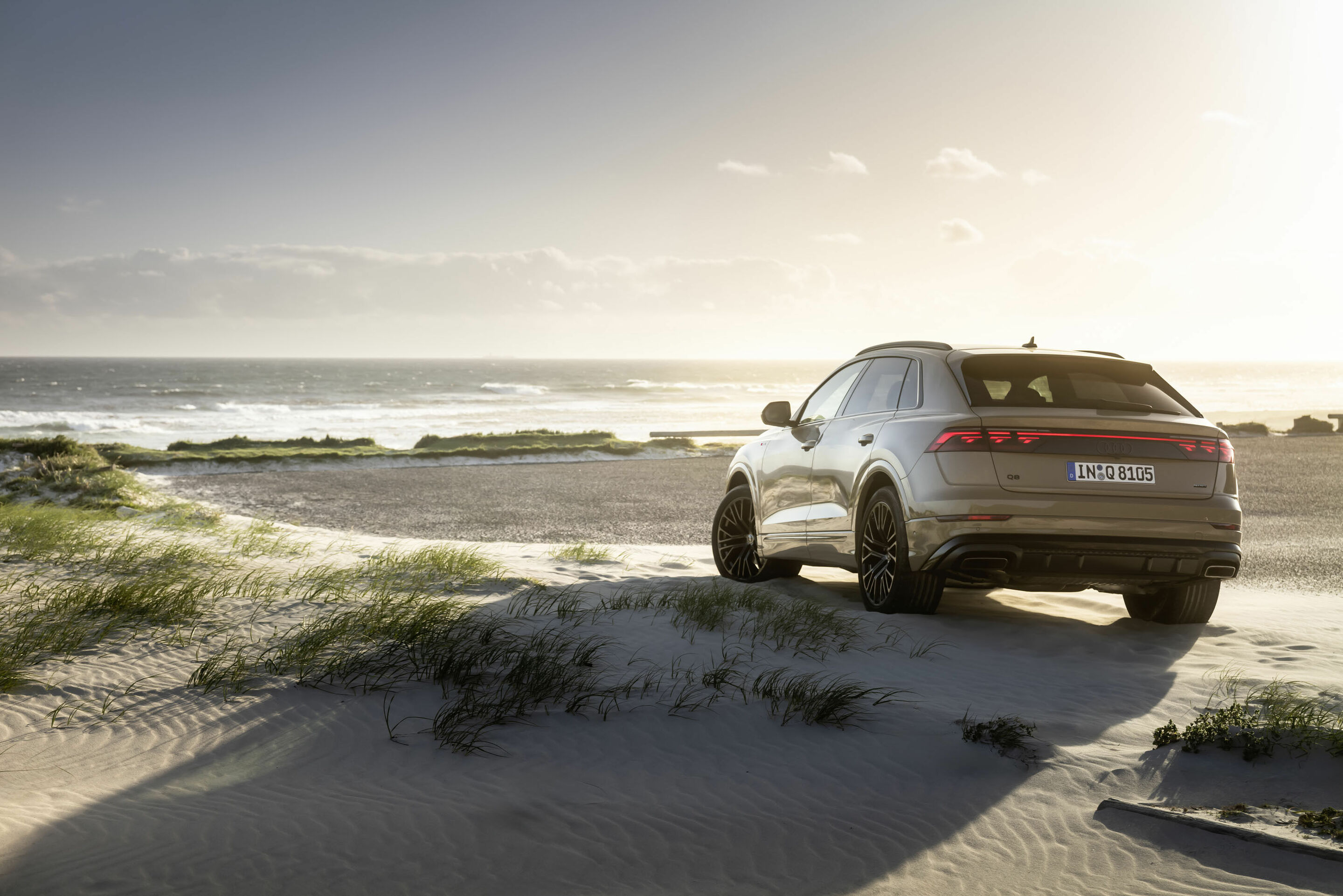 Audi Q8 (current gen) rear three-quarter, beach. Source: Audi MediaCenter A236010.