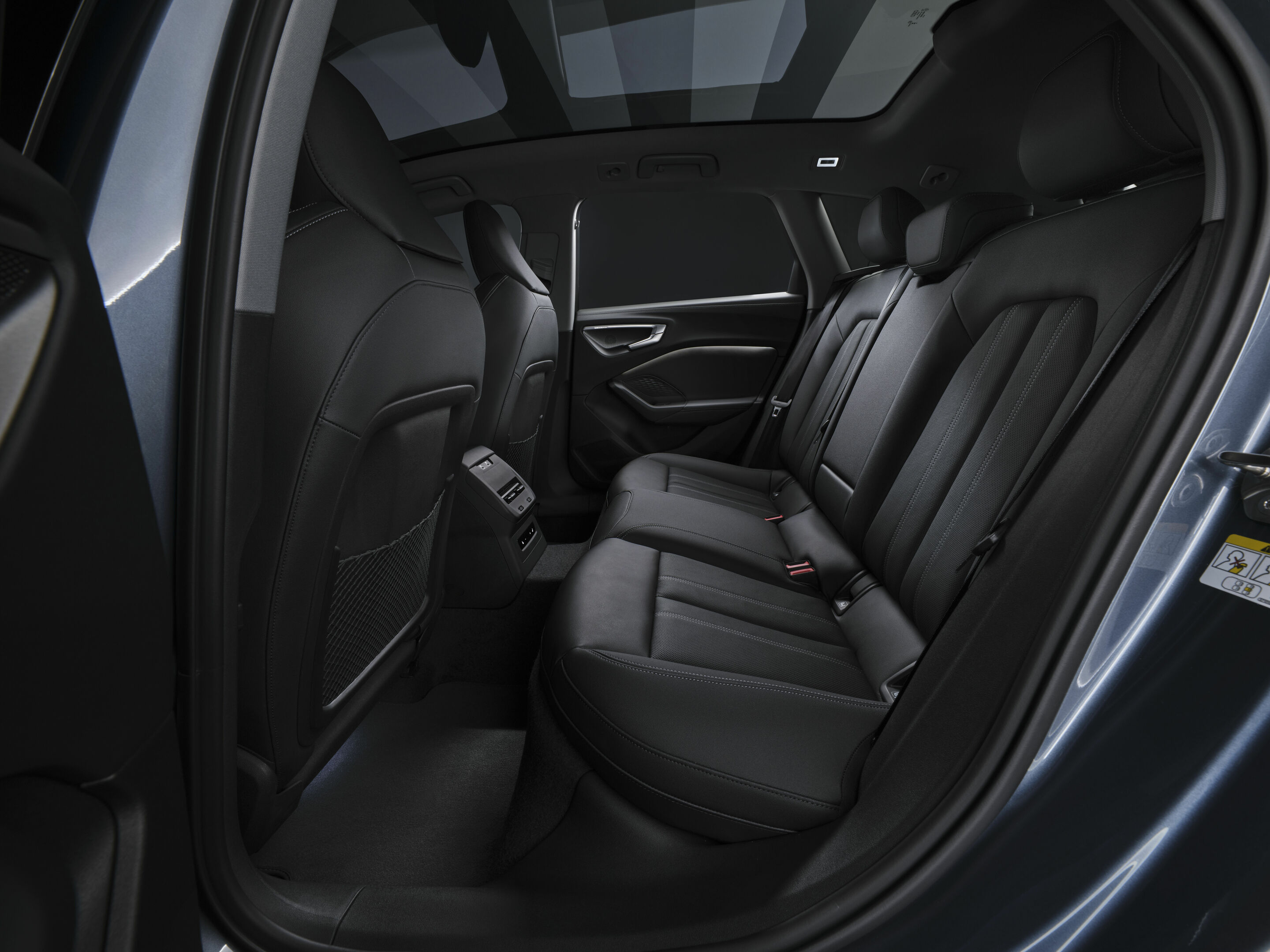 Audi A5 Avant, rear bench with doors open. Audi MediaCenter, editorial use.