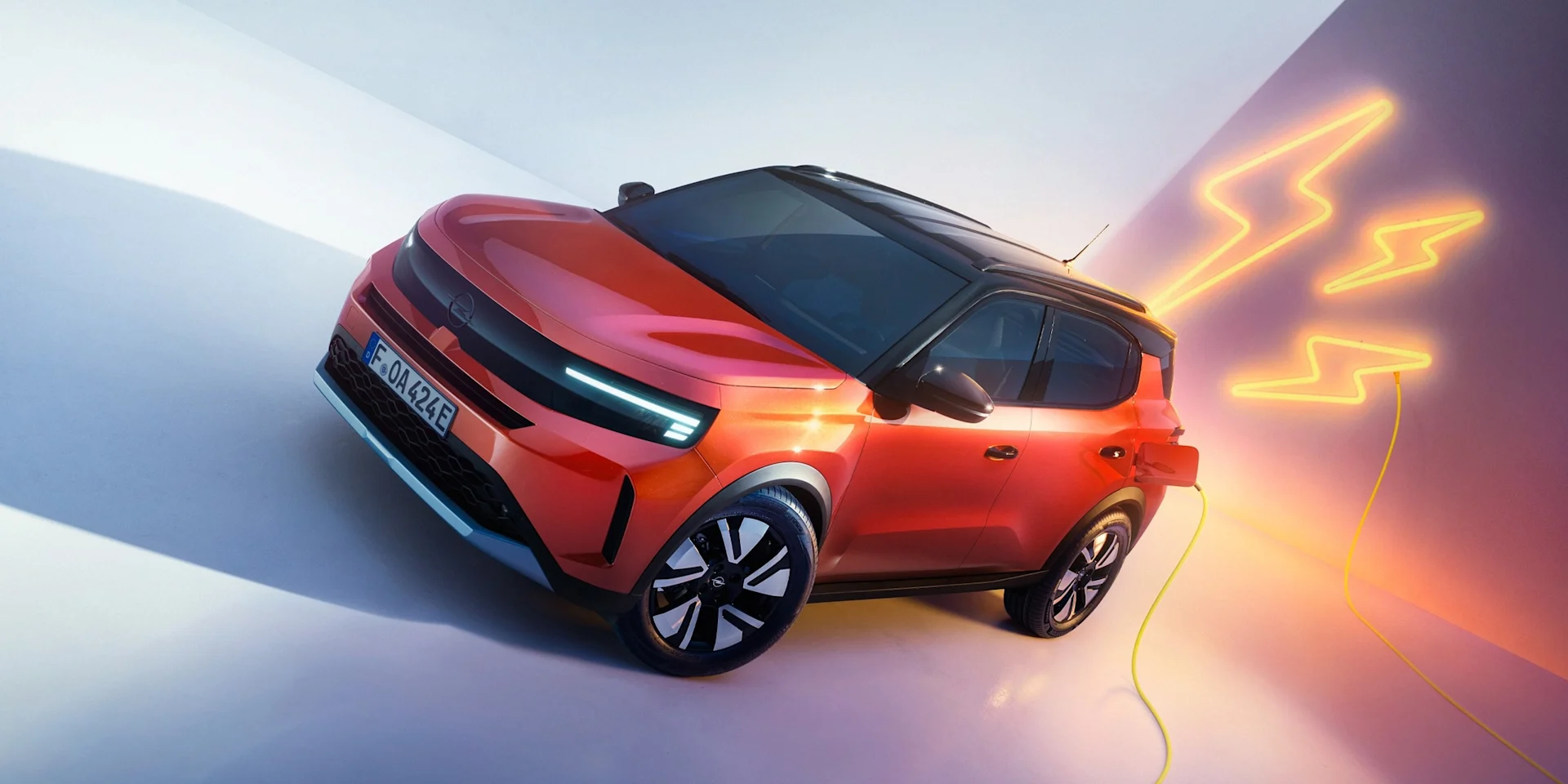 Source: https://www.opel.se/content/dam/opel/master/vehicles/frotera/update-model-page/21x9/OPEL-FRONTERA-MY2024-BEV-EXTERIOR-masthead-overview_21x9.jpg (2880x1235) — opel.se (Wismo, Swedish importer), team-cleared 2026-10-05. Cropped to 2:1 and downscaled to 2400x1200 (no upscaling). Run: 2026-10-07