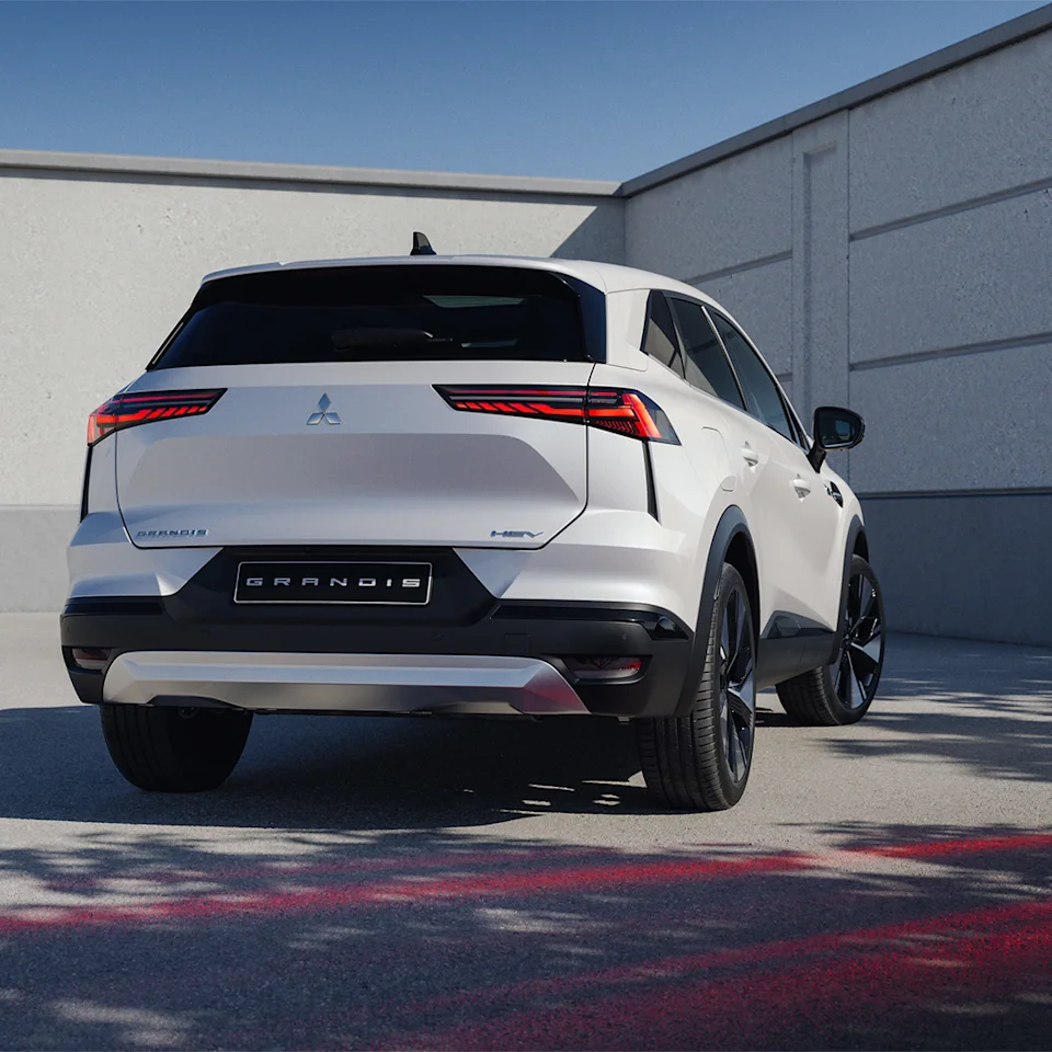 Source: https://www.mitsubishi-motors.se/wp-content/uploads/2026/04/MY2025_GRANDIS_Empowering-safety-systems_1080x1080.jpg (Wismo, Swedish importer) — OEM image, editorial use. Run: 2026-10-06