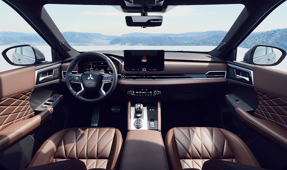 Source: https://www.mitsubishi-motors.se/wp-content/uploads/2024/10/5-Outlander_PHEV_2024_VLP_INTERIOR_2160-x-1280.jpg (Wismo, Swedish importer) — OEM image, editorial use. Run: 2026-10-06