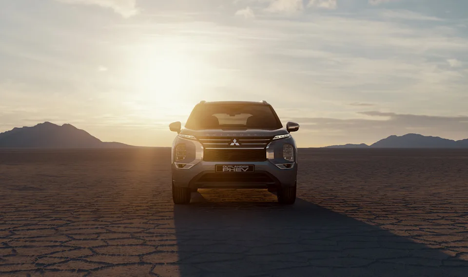 Source: https://www.mitsubishi-motors.se/wp-content/uploads/2024/10/2-Outlander_OHEV_2024_Take-a-step-further.jpg (Wismo, Swedish importer) — OEM image, editorial use. Run: 2026-10-06