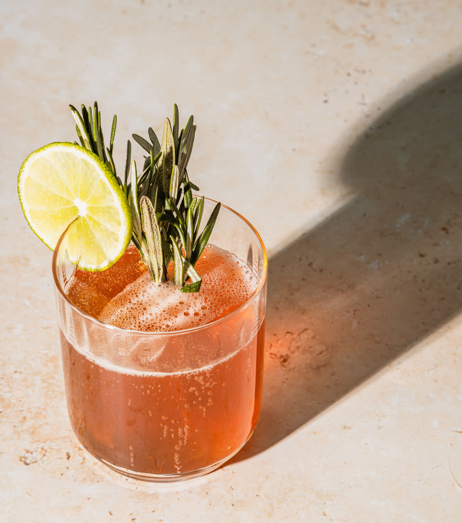 A cocktail with alcohol for hormonal balance and sprigs of thyme