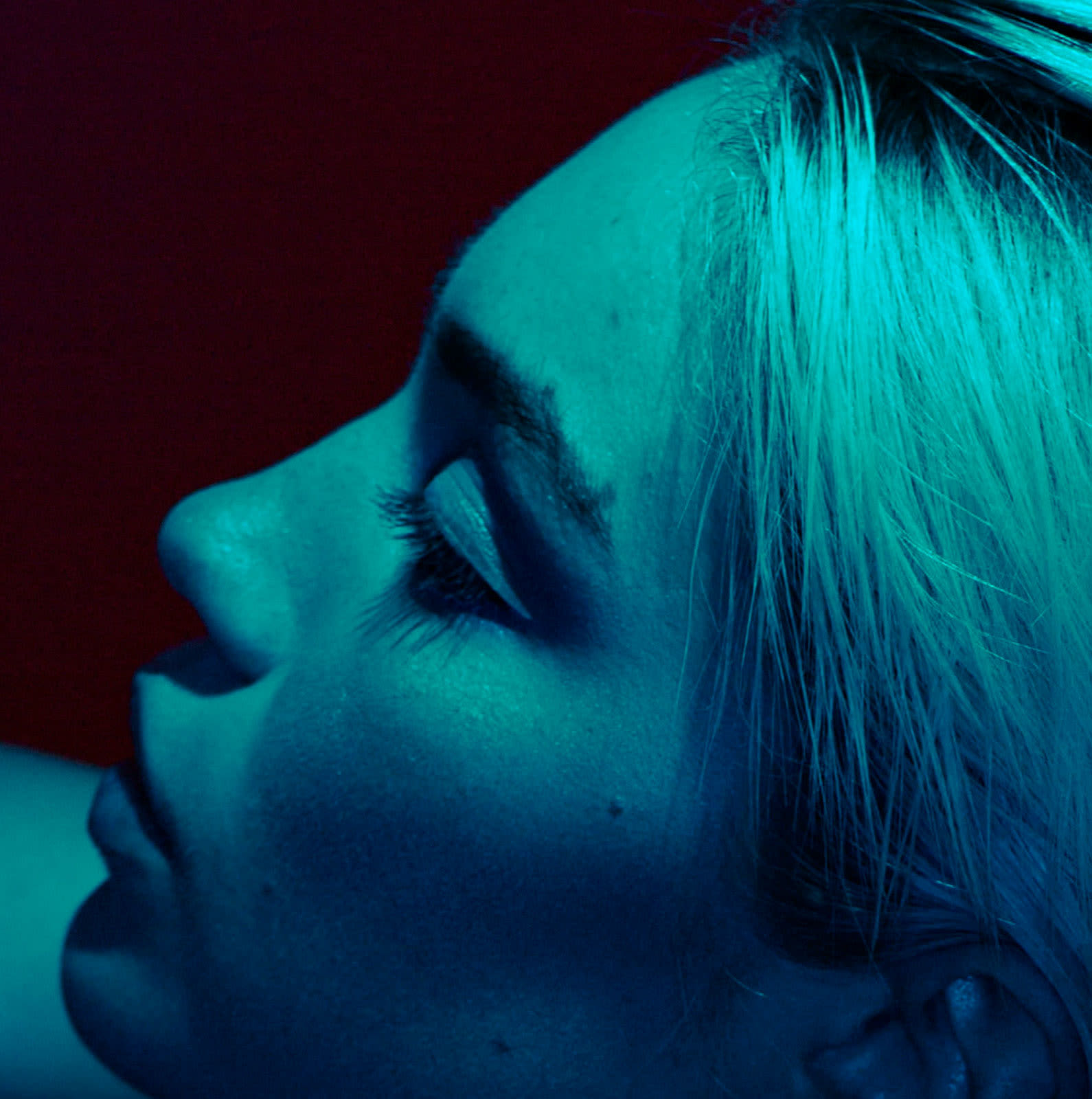 Woman's profile in blue tinted light