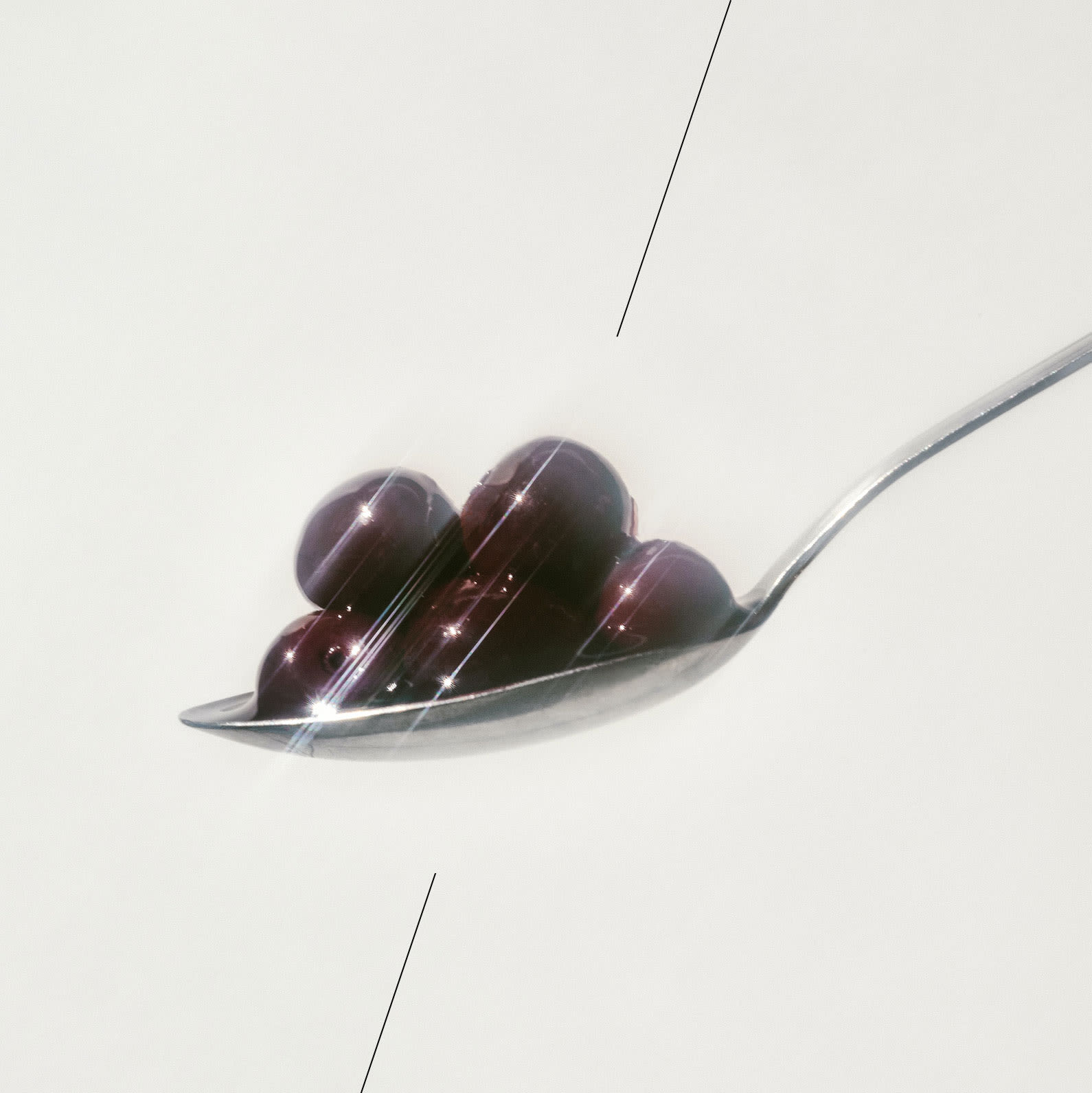 A spoon with antioxidant rich red cherries