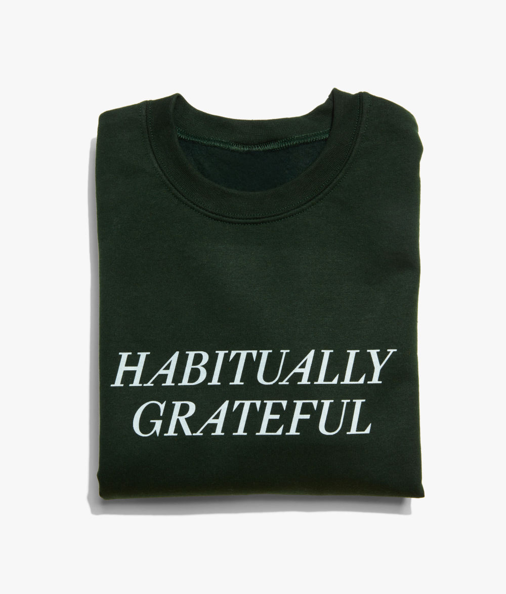 Folded green Habitually Grateful sweatshirt 