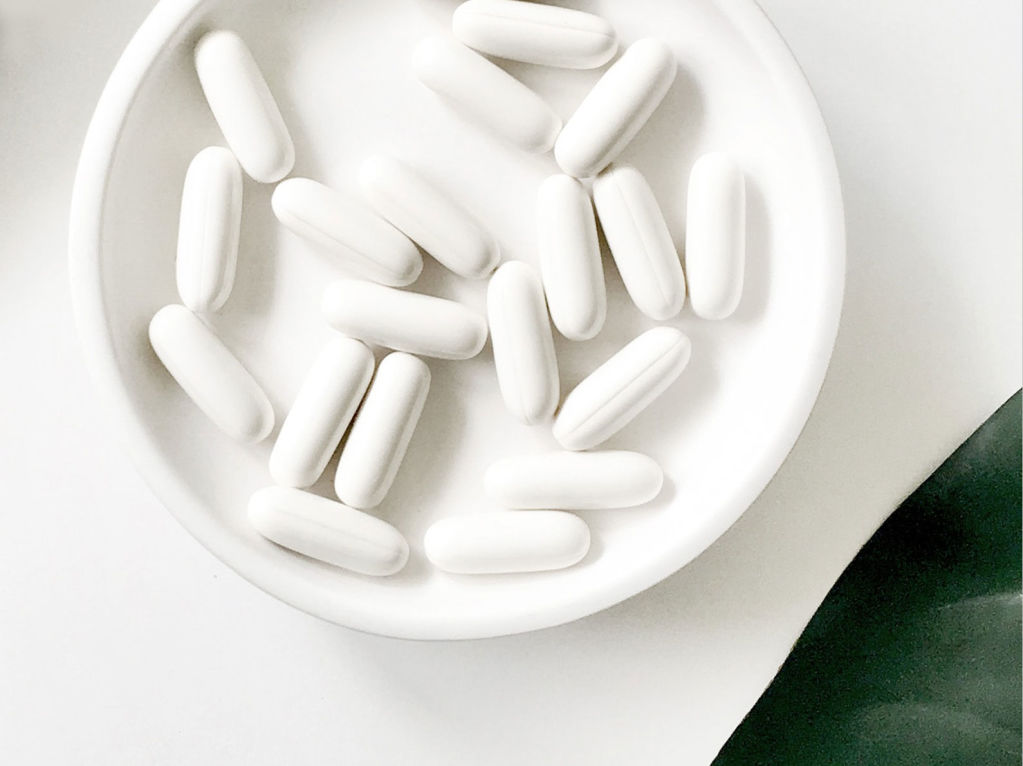 White pills in a white dish