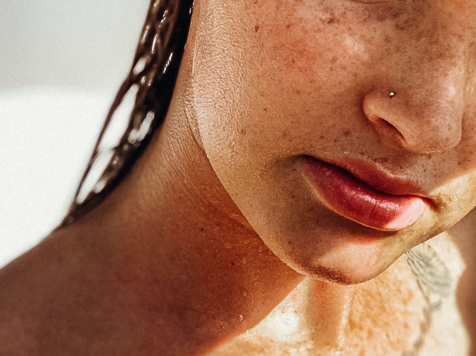 Woman's face with freckles and dark spots