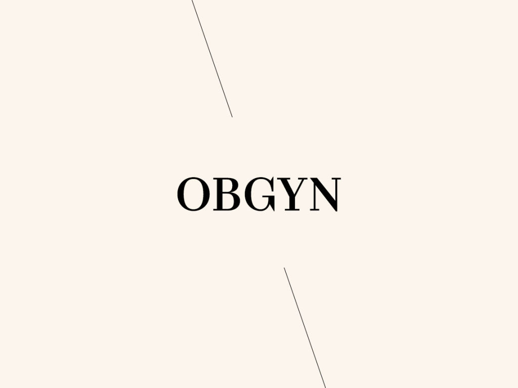The word OBGYN in black on cream background