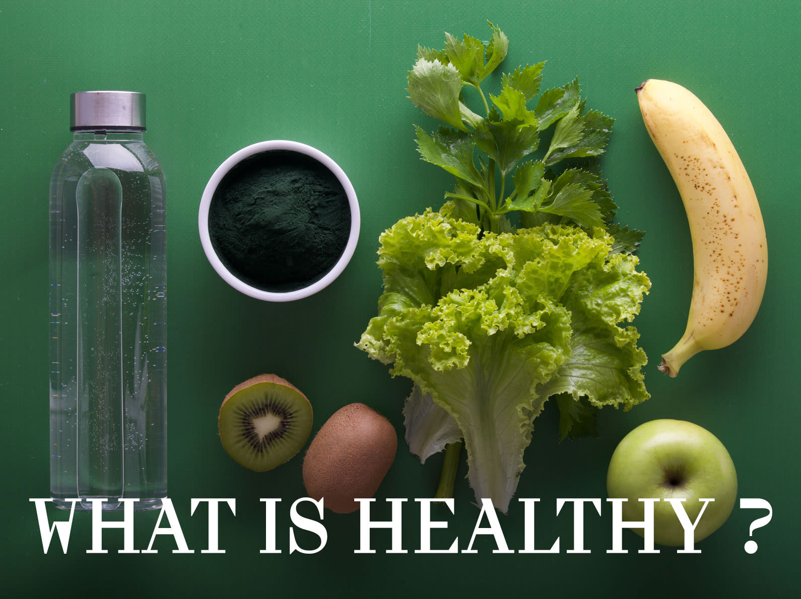 Still life with glass water bottle, matcha, lettuce, kiwi, banana and green apple and 'What is healthy?' text overlay.