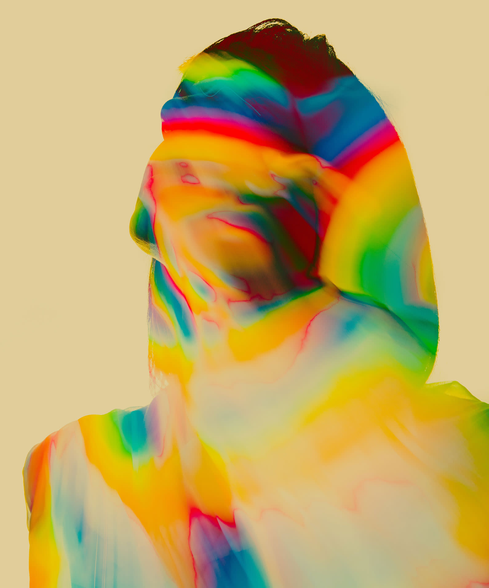 Woman's head and torso awash with rainbow colors alluding to mental state