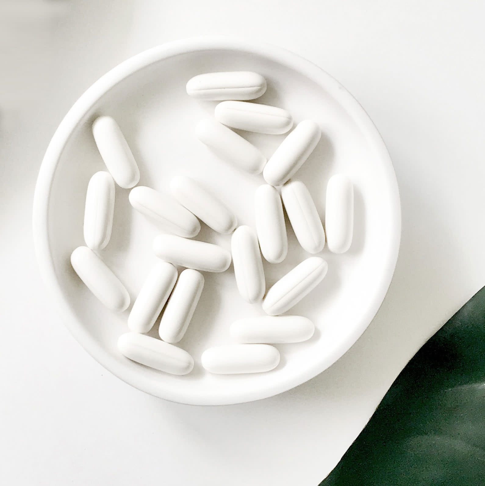 White pills in a white dish