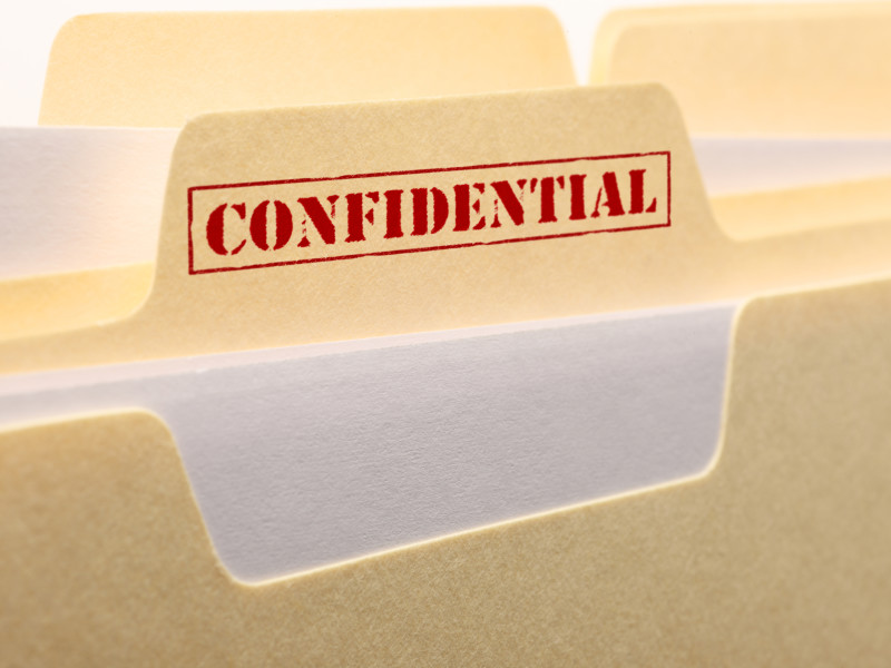 Manilla folder with a red Confidential stamp