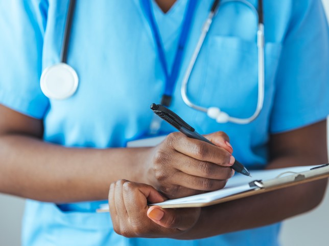 man in scrubs getting supplemental malpractice insurance