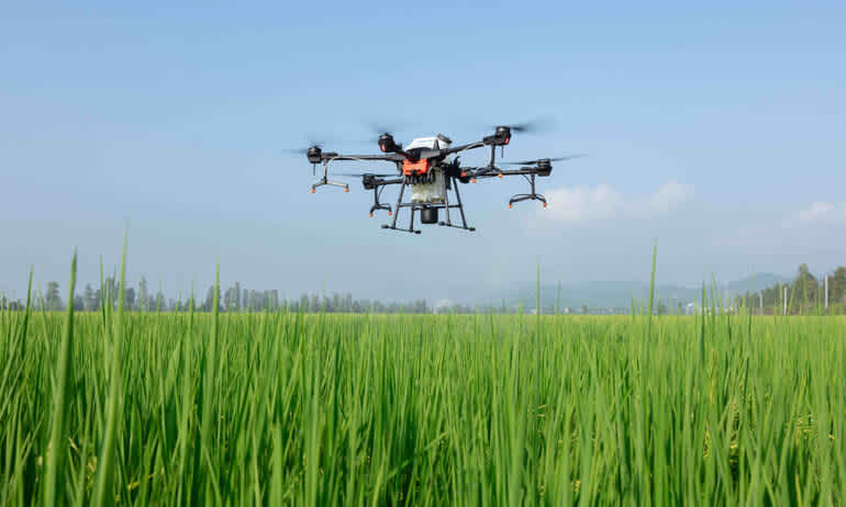 product shot of the DJI t-20 drone in mid flight