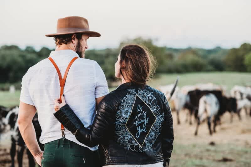 farmer and wife with cattle