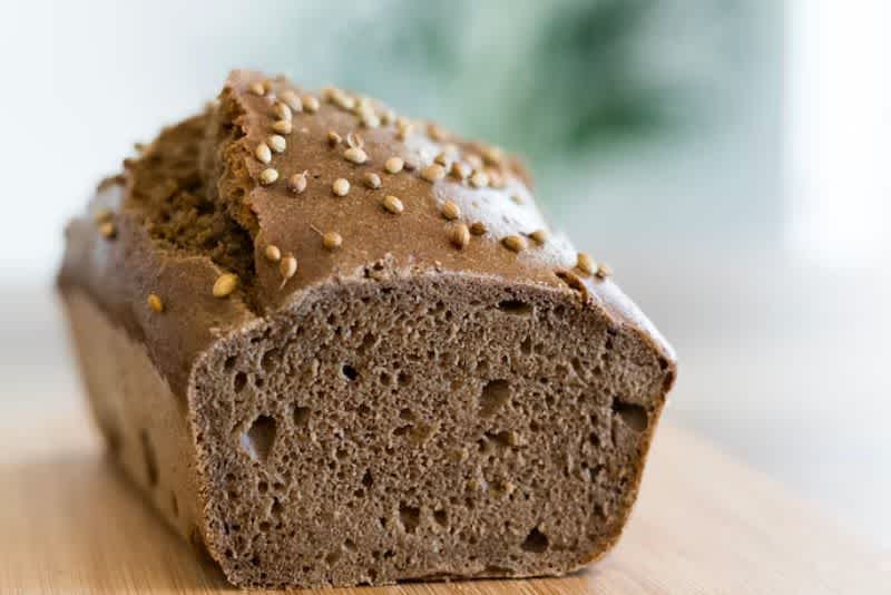 Side view of brown sourdough rye bread on a countertop