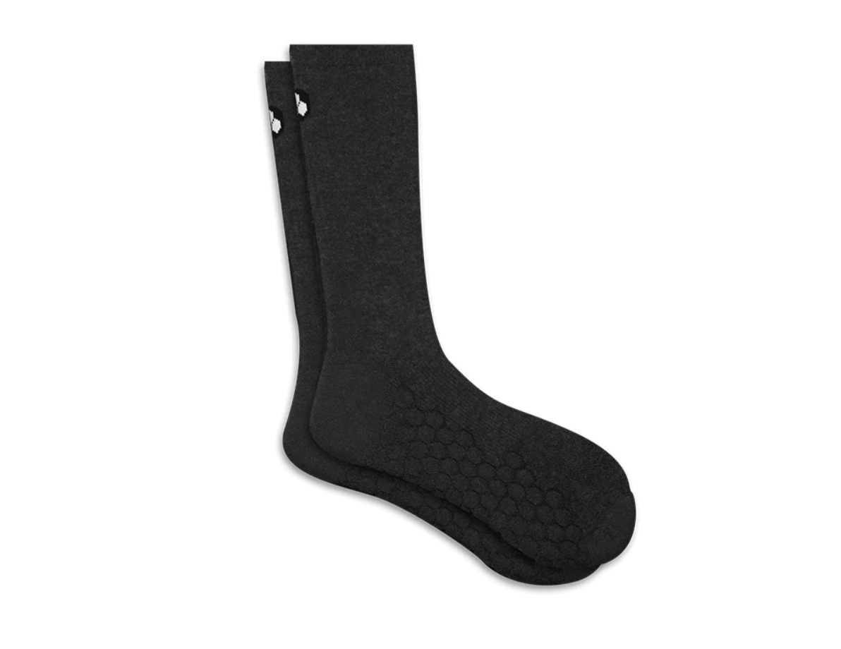 a pair of merino wool padded socks laying on top of each other