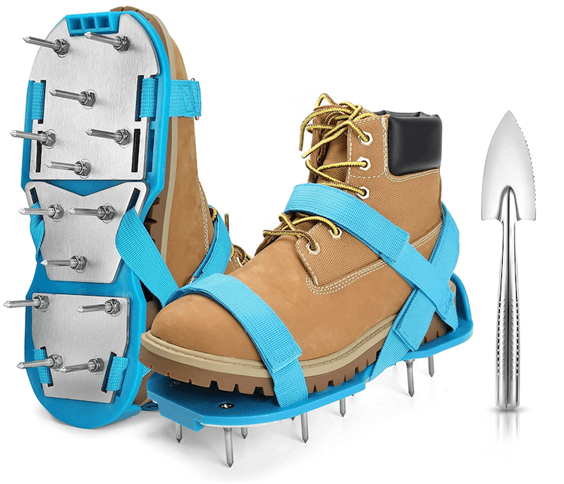 Blue lawn aerator shoes on tan hiking boots
