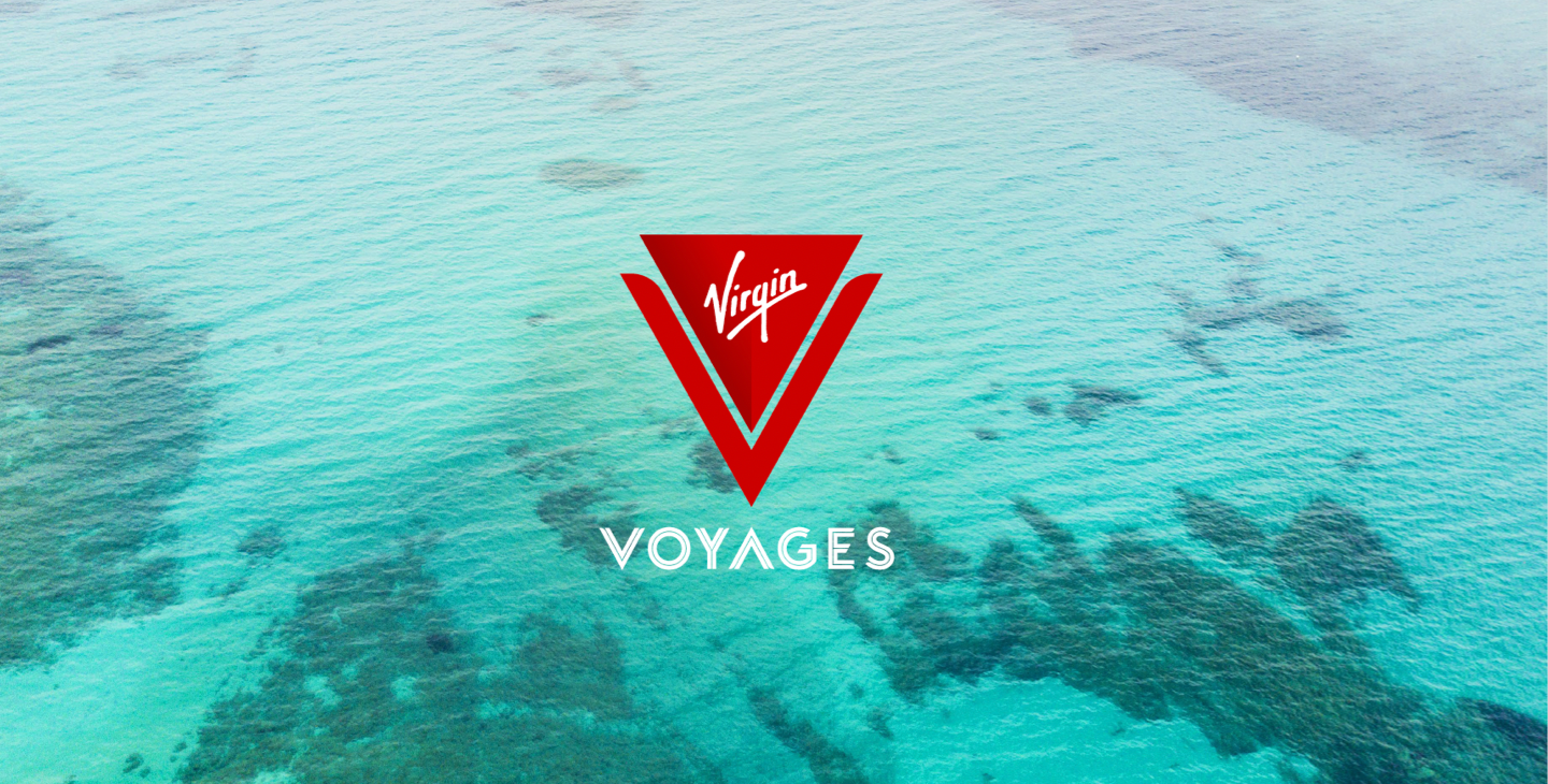 Virgin Voyages red logo over sea water.