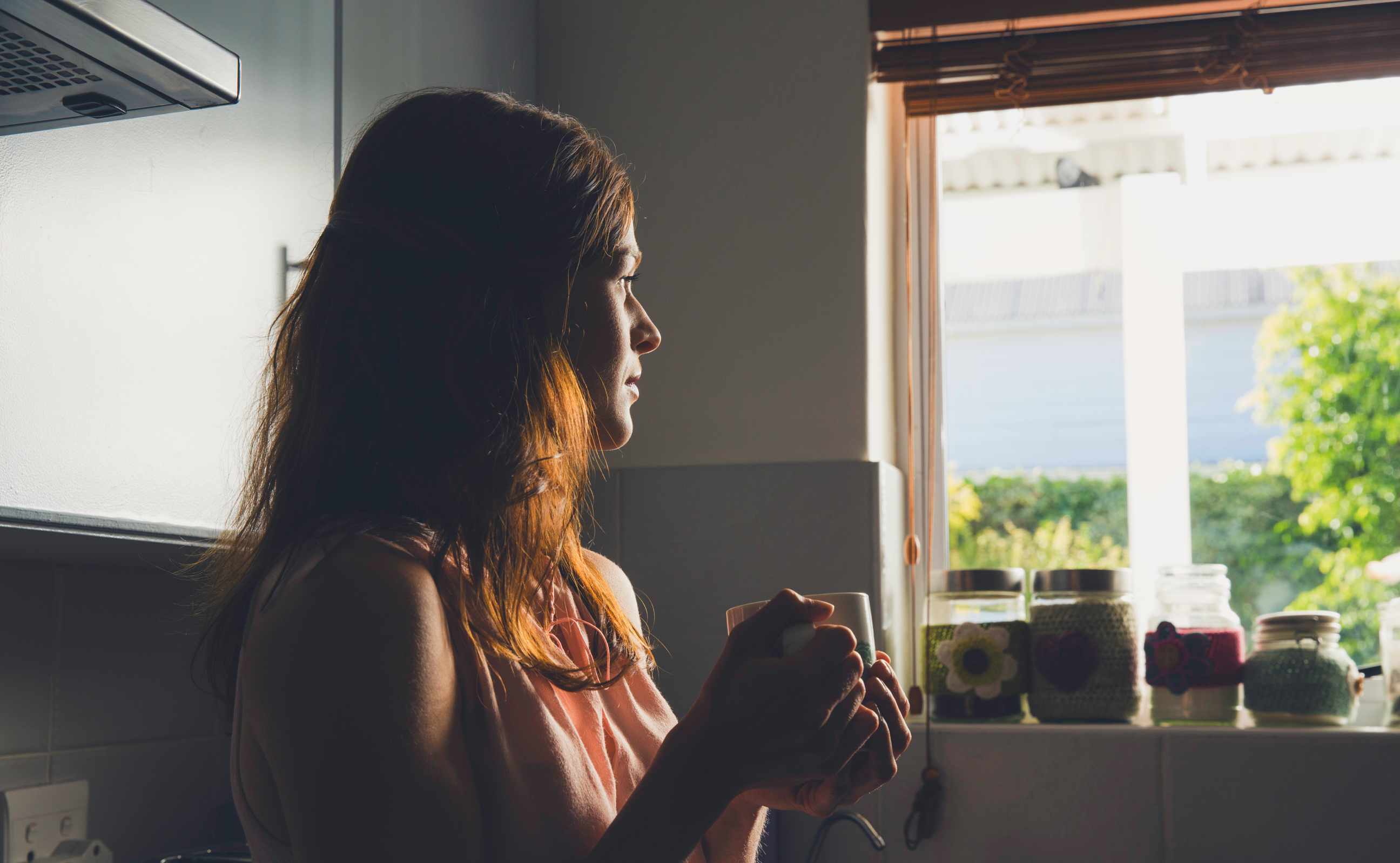 Woman looking out window