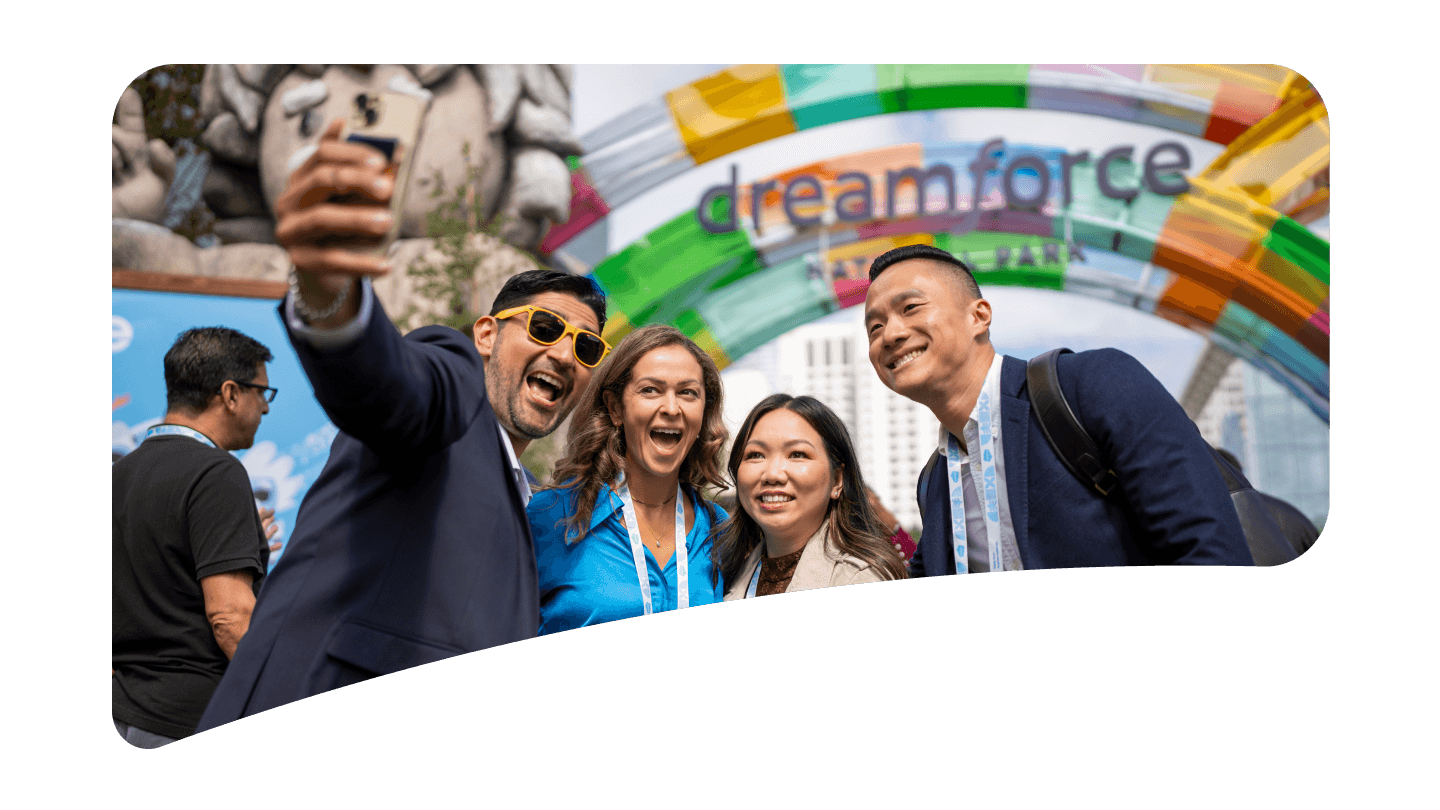 Dreamforce attendees in front of the Dreamforce campground sign 