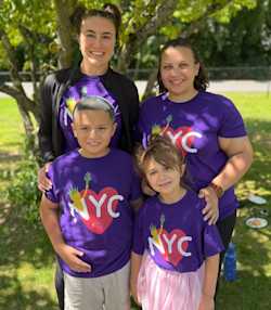 Two students, two adults, photo under tree, NYC tshirts
