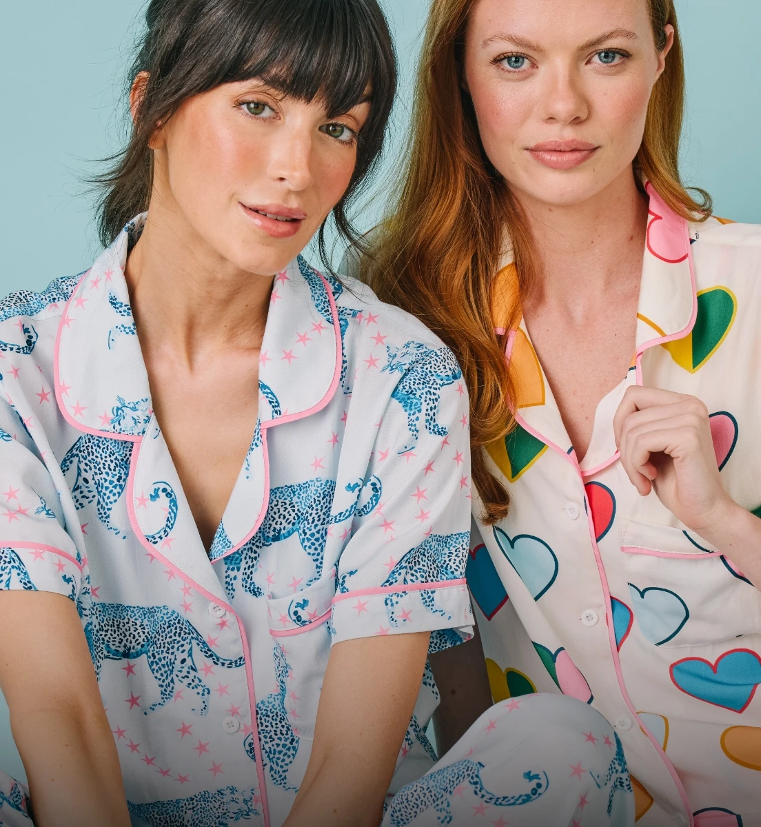 Two people wearing Katie Kime pajamas