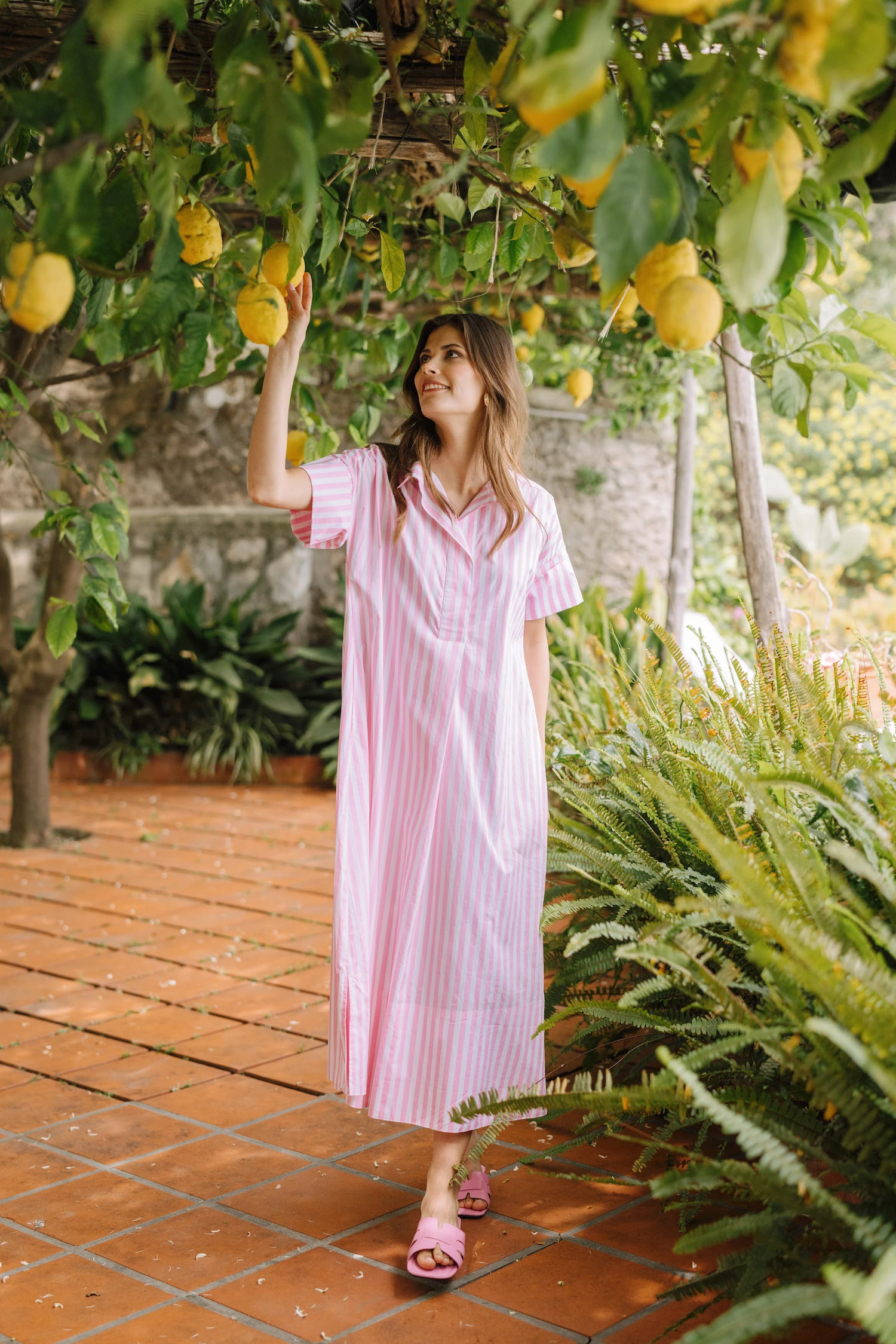 girl in lemon grove in amalfi