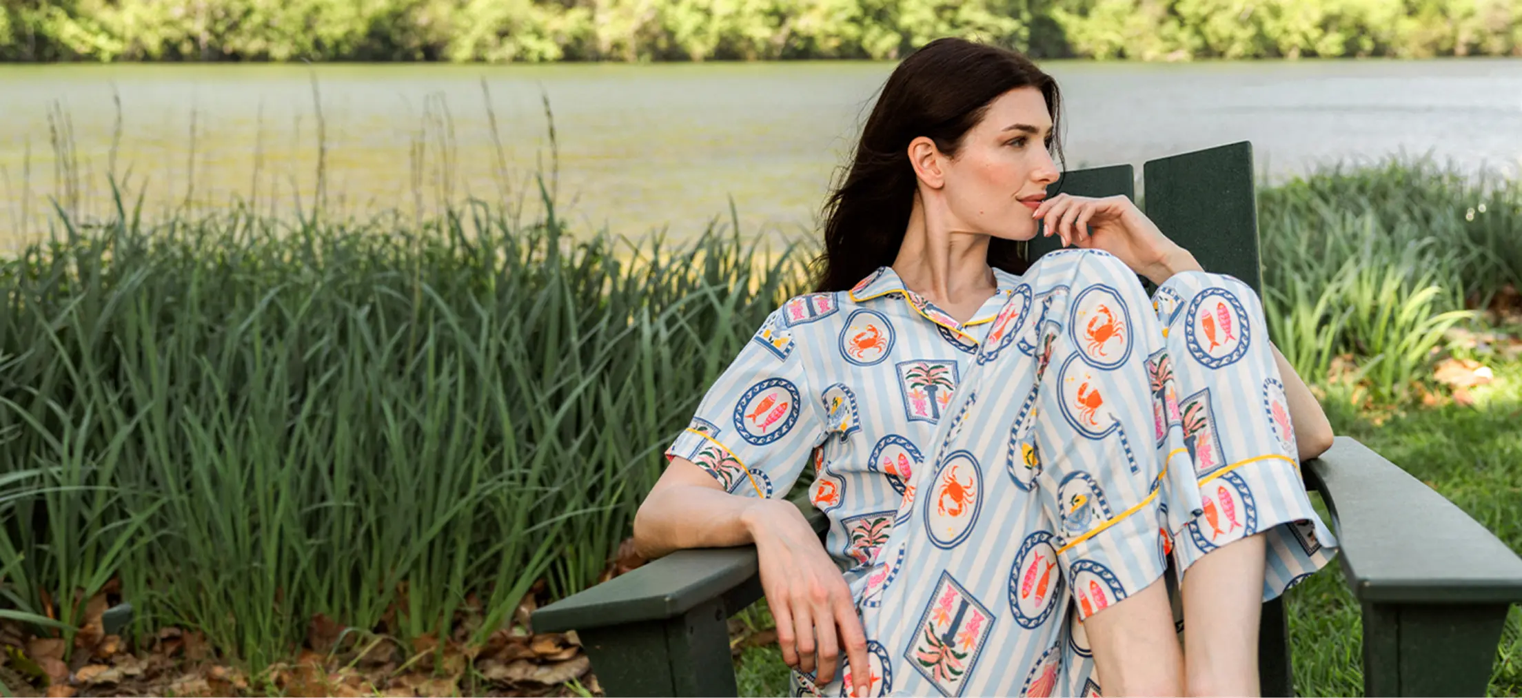 a woman wearing the seaside stripe pajama pants set