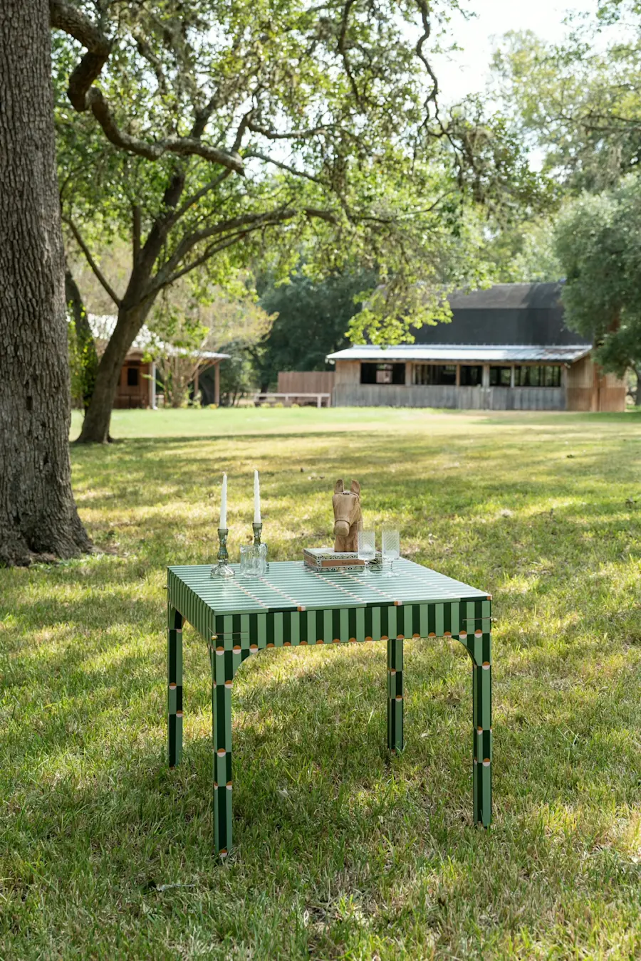 The Palisades Green game table on the lawn