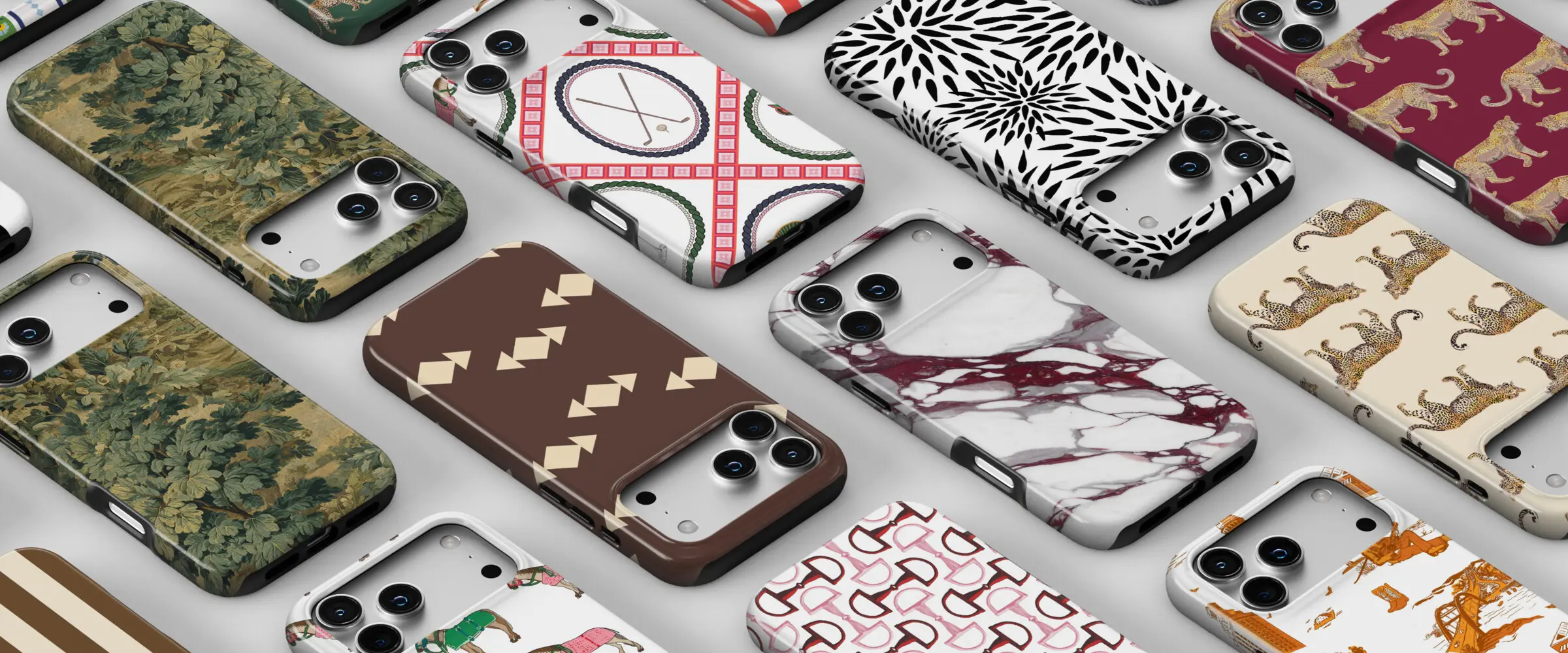 Katie Kime fall phone cases laid out on a table