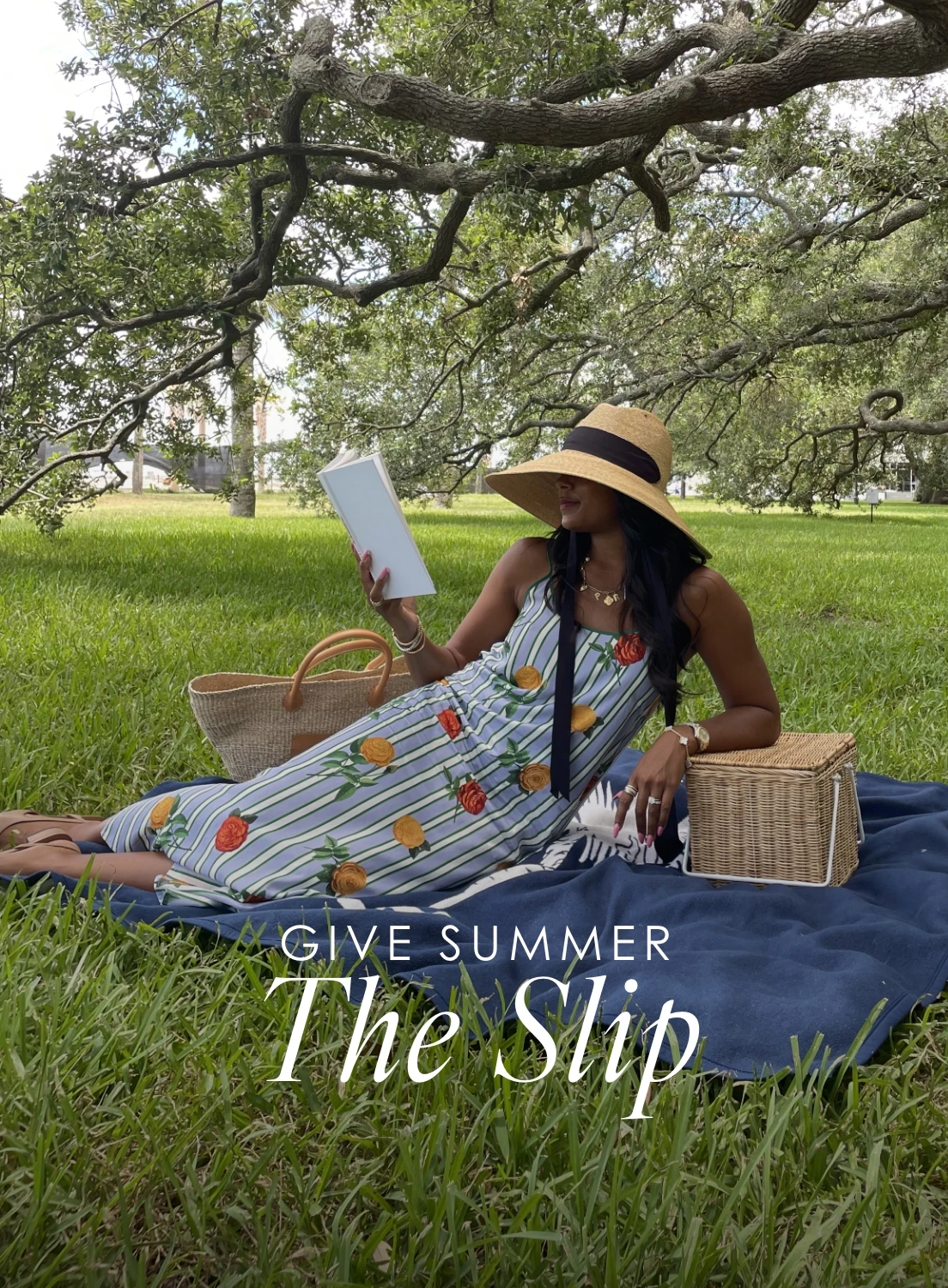A woman in a park wearing the katie kime slip dress in the derby rose print