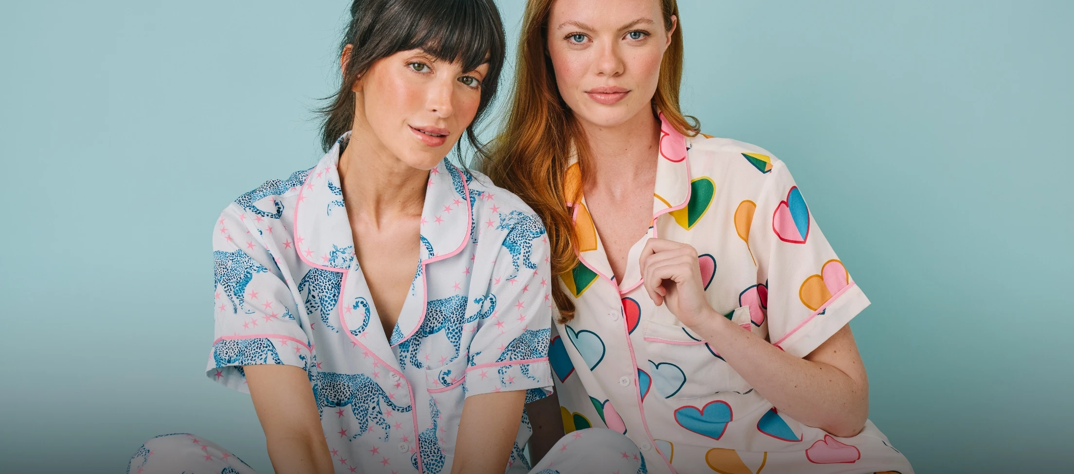 Two people wearing Katie Kime pajamas