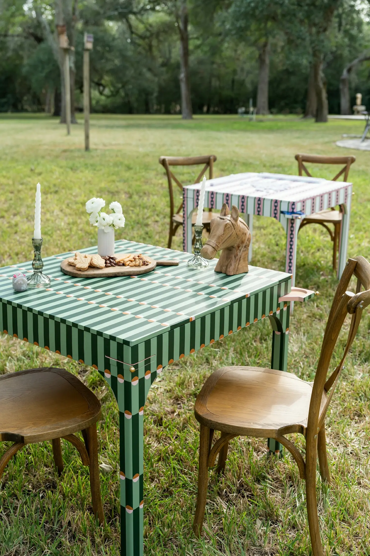 An Avella Interiors game table wrapped in Katie Kime Palisades Green, set for mahjong under the oaks