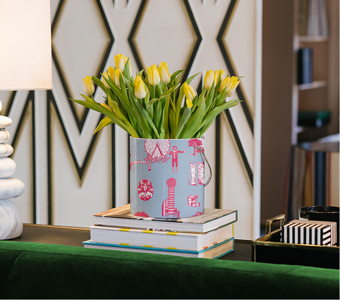 an ice bucket with the dallas toile print and tulips in it