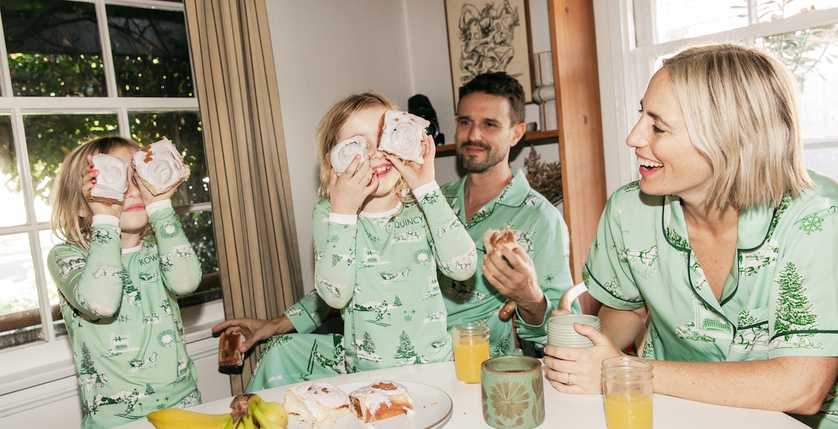Family eating breakfast wearing matching Katie Kime pajamas